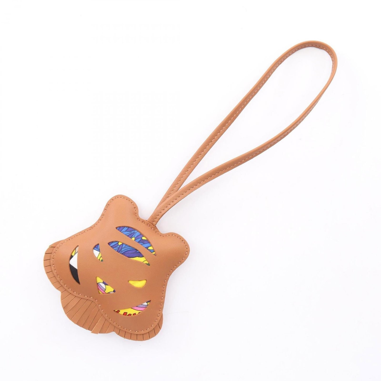 HERMES Handbag Charm Agneau Milo: HERMES Handbag Charm Agneau Milo Agneau Milo Handbag Charm by Hermes, a multi-colored brown charm with a unique design. The charm is made of Agneau Milo material and features minor signs of wear,