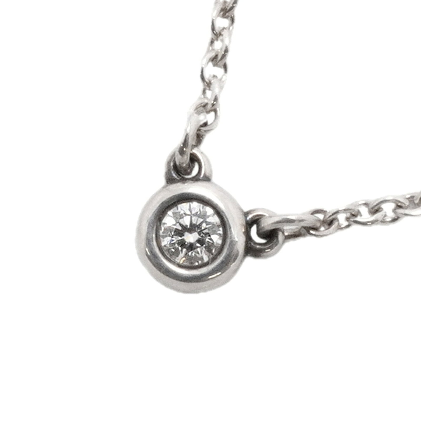 TIFFANY Silver 925: TIFFANY Silver 925 Tiffany Silver 925 Necklace: A Timeless Diamond Pendant. This 41cm necklace features a 4.2mm x 3.7mm diamond pendant set in sterling silver 925, bearing a visible signature. With it