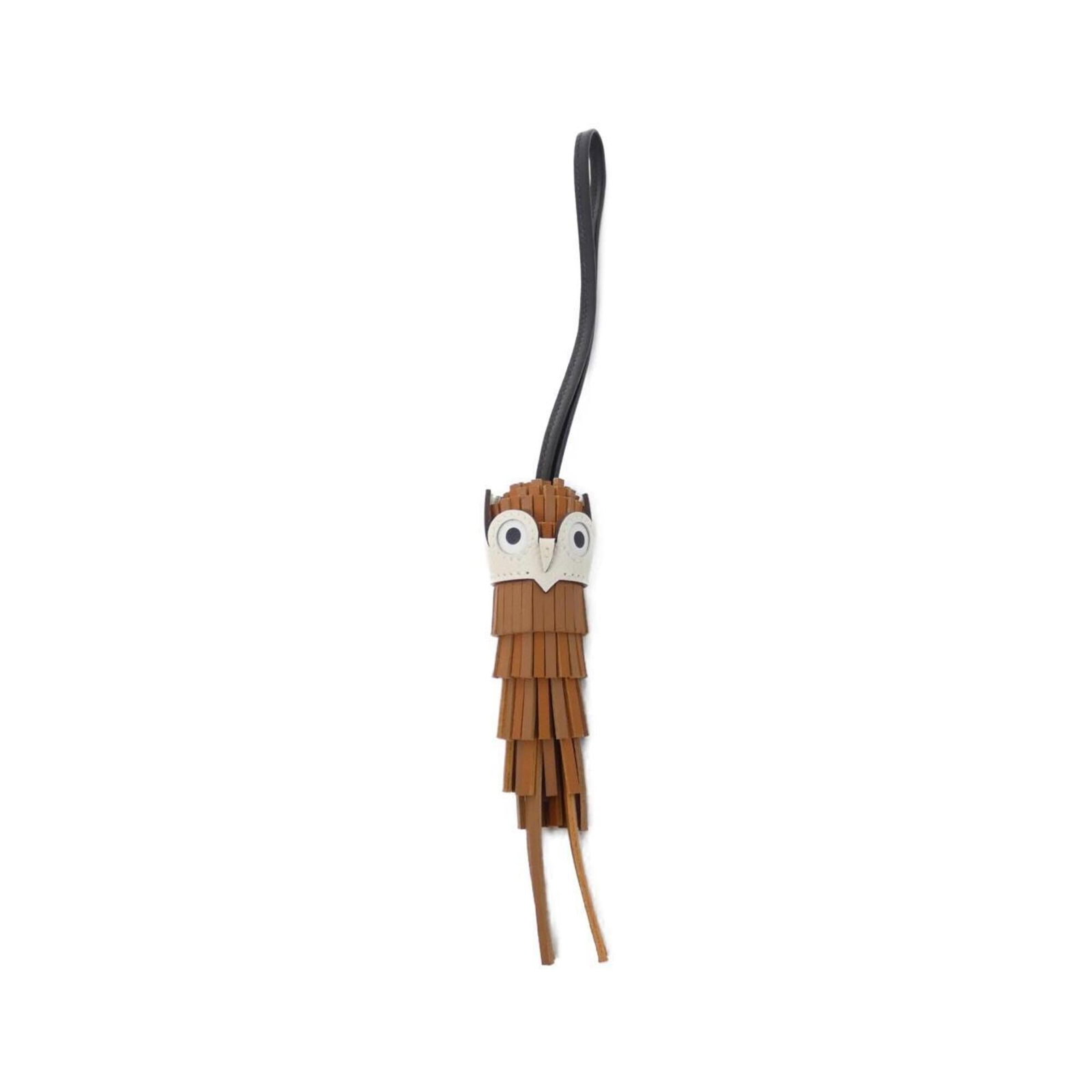 HERMES Handbag Charm Agneau Milo Swift Leather: HERMES Handbag Charm Agneau Milo Swift Leather Agneau Milo Swift Leather Handbag Charm from Hermes. This black and gold handbag charm features a sleek design made from high-quality Agneau Milo and