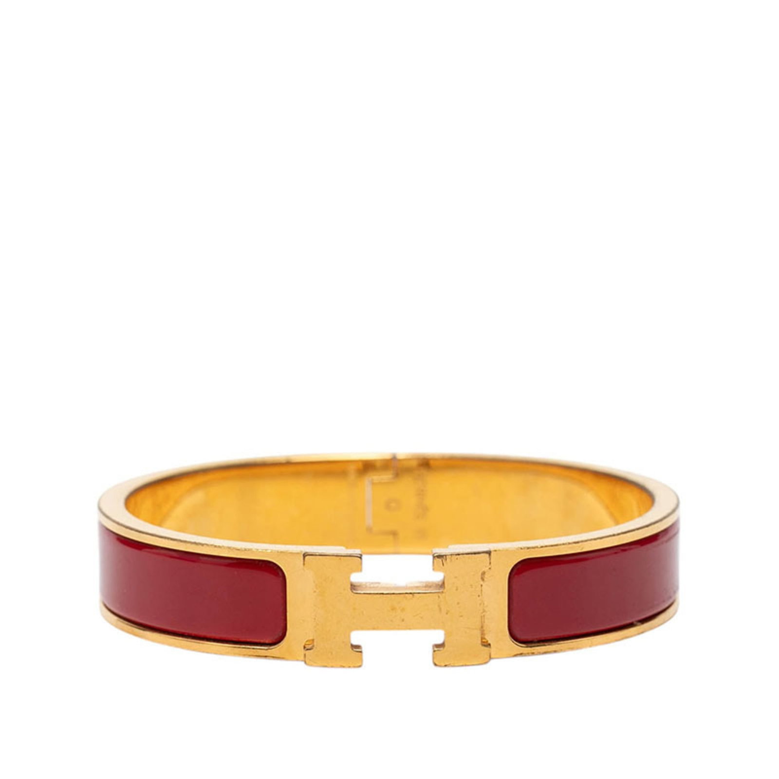 HERMES Charm Bracelet Gold Red Color: HERMES Charm Bracelet Gold Red Color Gold Red Color Charm Bracelet from Hermes, a 15.5cm long charm bracelet with a distinctive red hue, featuring visible wear and minor scratches. This pre-owned