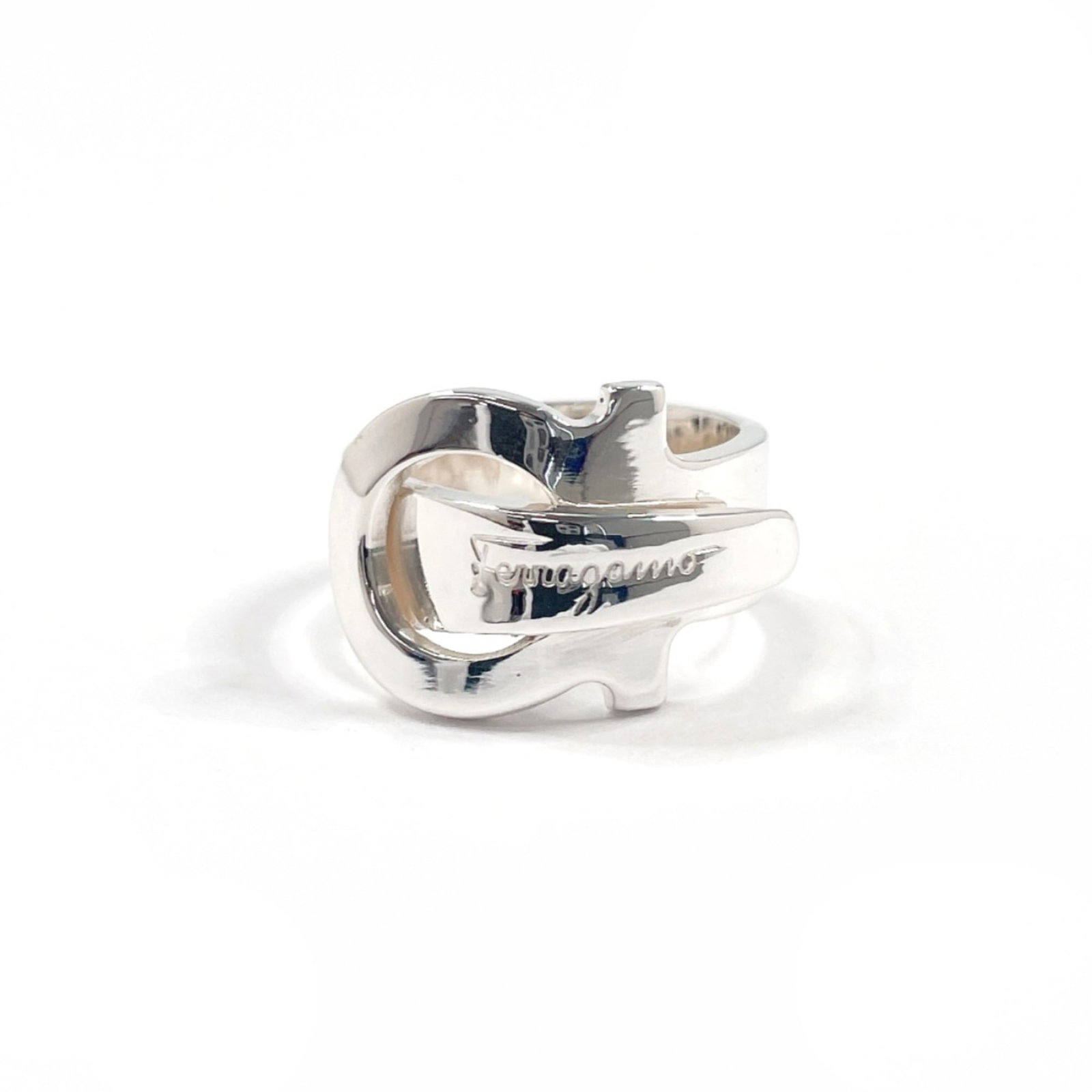 SALVATORE FERRAGAMO Band Ring Silver 925: SALVATORE FERRAGAMO Band Ring Silver 925 Silver 925 band ring from Salvatore Ferragamo's Gancini line, crafted in Italy. Features a sleek silver design with minor signs of wear, including small scratc
