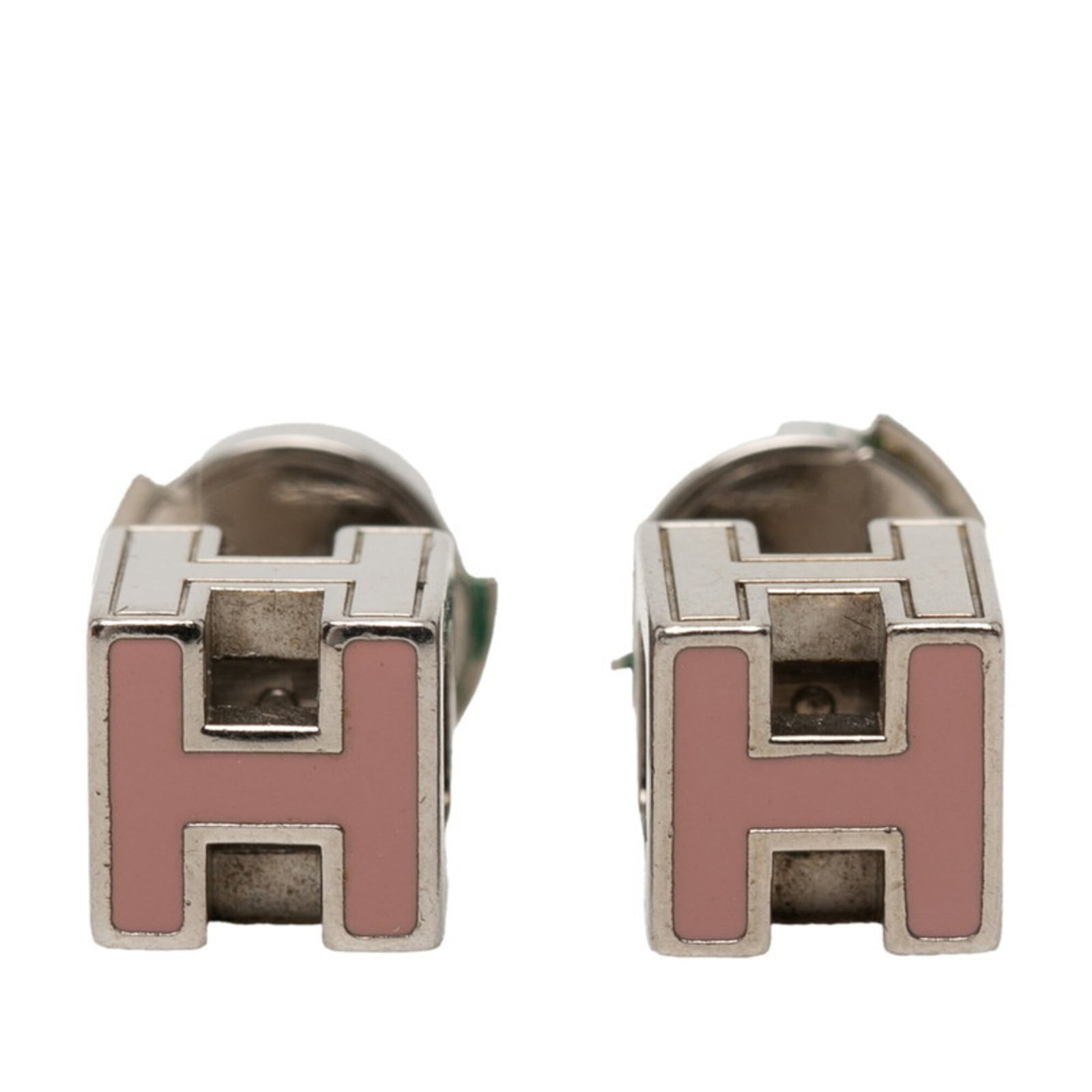 HERMES Stud Earrings Metal: HERMES Stud Earrings Metal Pink and silver stud earrings from Hermes, featuring a subtle design. The earrings have visible wear, including scratches and scuffs, and are in good overall condition.