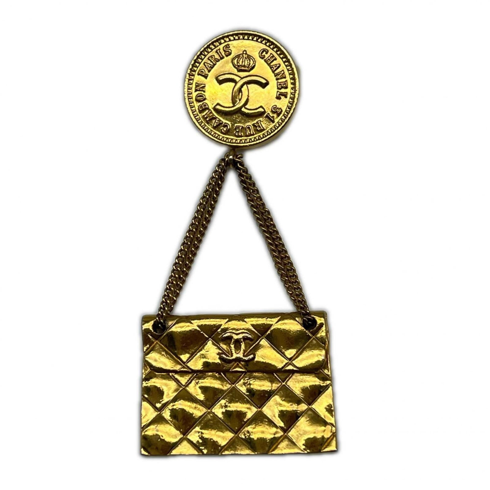 CHANEL Brooch Gold: CHANEL Brooch Gold Gold plated CHANEL brooch with a sleek, sophisticated design. Measuring 7.5cm x 3.5cm, this 20g brooch features a subtle gold finish with visible wear, including scratches and
