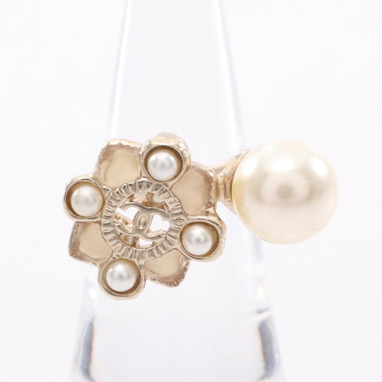 CHANEL Band Ring Artificial Pearl Gold Plating: CHANEL Band Ring Artificial Pearl Gold Plating Gold plated band ring featuring artificial pearl details, a classic Chanel design. This gently used piece shows minor signs of wear, with small