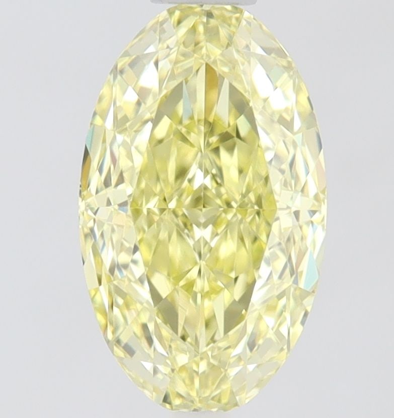 GIA Oval 0.71ct Fancy Yellow VVS2 - Loose Natural Diamond: GIA Oval 0.71ct Fancy Yellow VVS2 - Loose Natural Diamond GIA certifies this 0.71ct oval Fancy Yellow diamond with exceptional clarity and polish, boasting an EX polish and VG symmetry. The VVS2