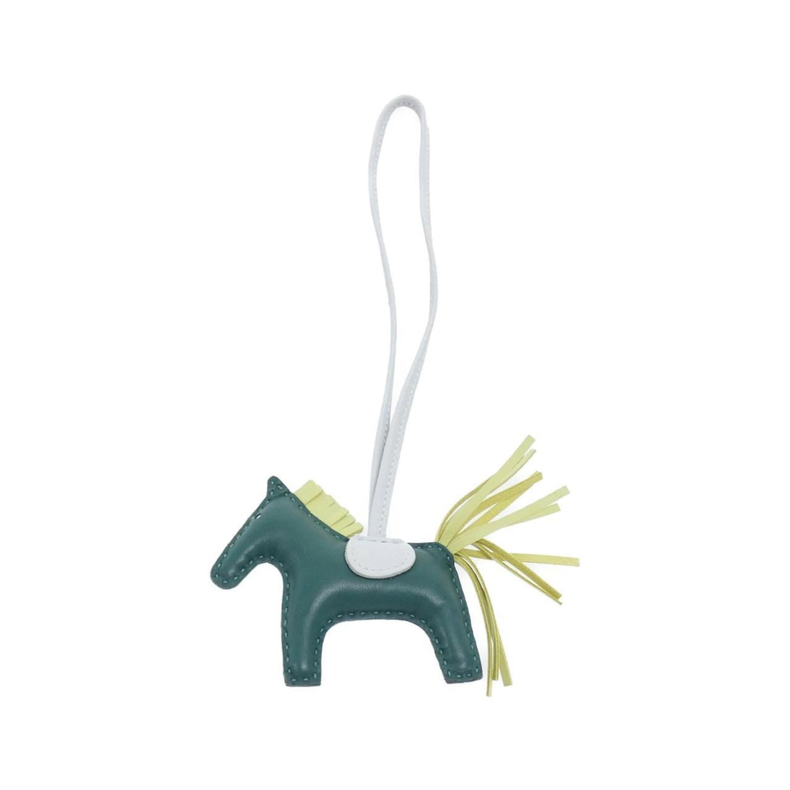 HERMES Handbag Charm Agneau Milo: HERMES Handbag Charm Agneau Milo Agneau Milo, a unique material, is used to create this Hermes Handbag Charm. The charm features a distinctive green color and measures 75.00mm x 85.00mm. It is in