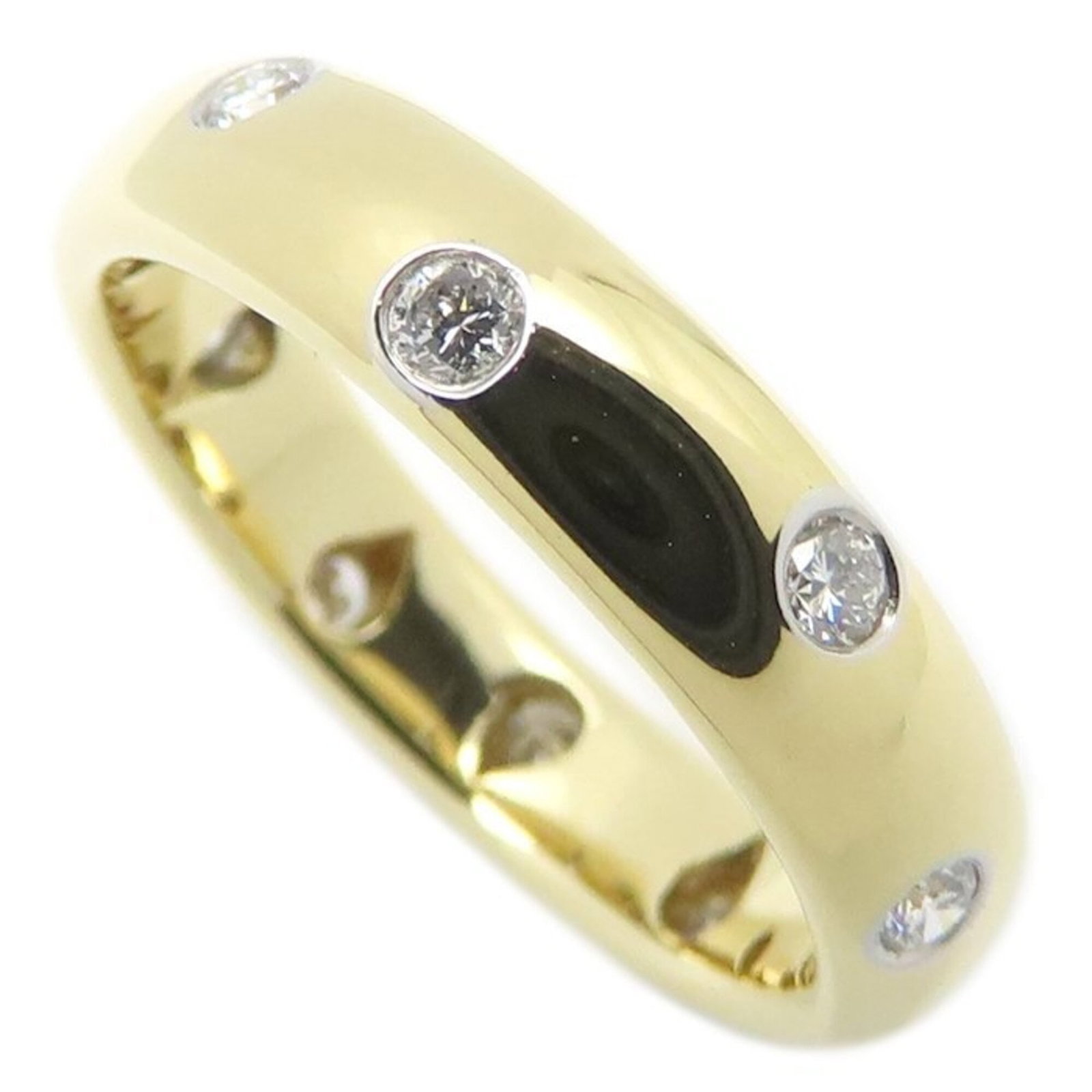 TIFFANY Band Ring Platinum 950 Yellow Gold (18K): TIFFANY Band Ring Platinum 950 Yellow Gold (18K) Platinum 950 Yellow Gold 18K band ring from Tiffany, featuring a diamond stone and a sleek 4.2mm width. This gently used ring showcases minor signs of