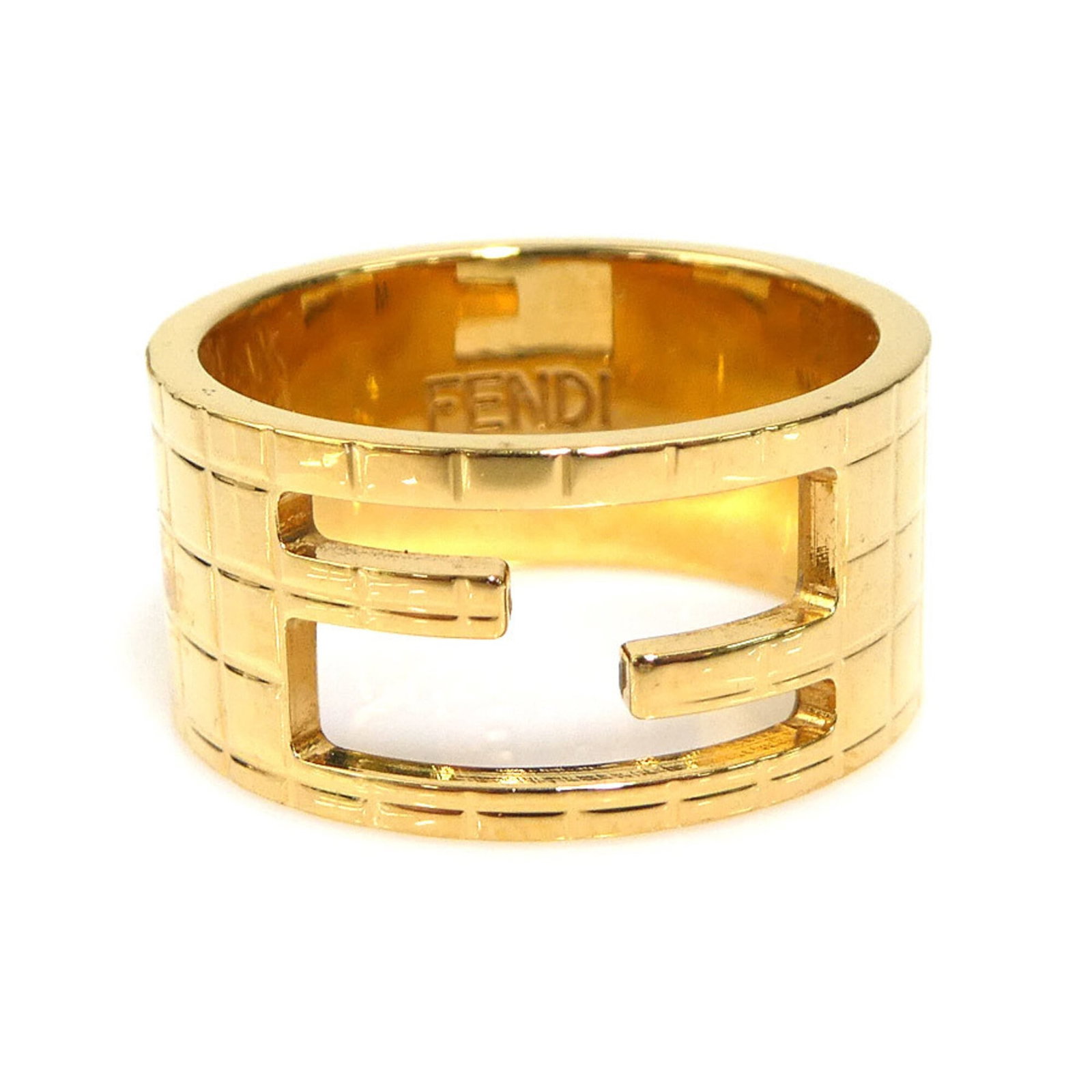 FENDI Band Ring Metal: FENDI Band Ring Metal This Fendi Band Ring Metal is a gold metal band ring with visible scratches and scuffs, offering a unique, worn look. Made from metal, it features a classic band design that suit