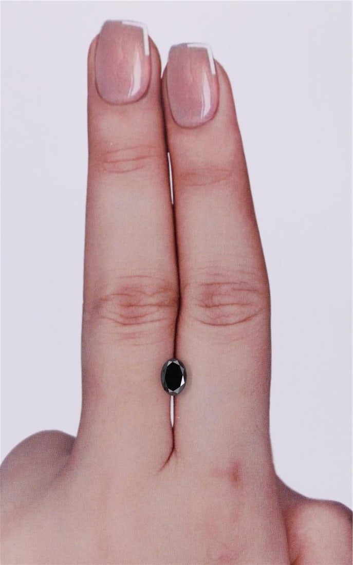 GIA Oval 0.69ct Fancy Black VVS2 - Loose Natural Diamond: GIA Oval 0.69ct Fancy Black VVS2 - Loose Natural Diamond GIA Oval 0.69ct Fancy Black VVS2 - Loose Natural Diamond. This oval-cut diamond boasts a stunning Fancy Black color and exceptional clarity,