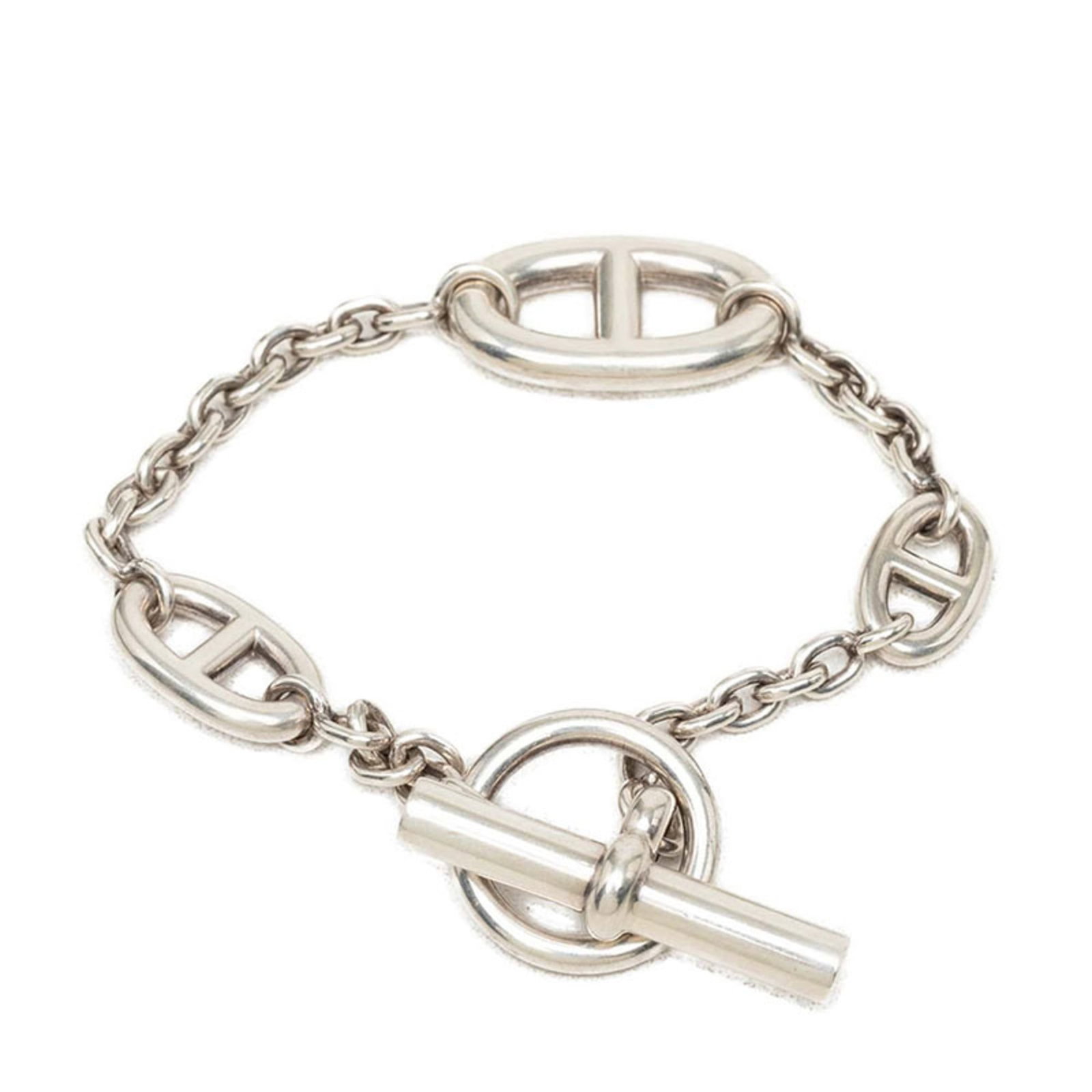 HERMES Charm Bracelet Silver 925: HERMES Charm Bracelet Silver 925 Silver 925 Charm Bracelet from Hermes Features a classic charm design, measuring 18.5cm in length, with visible wear and scratches. The item is made from high-quality