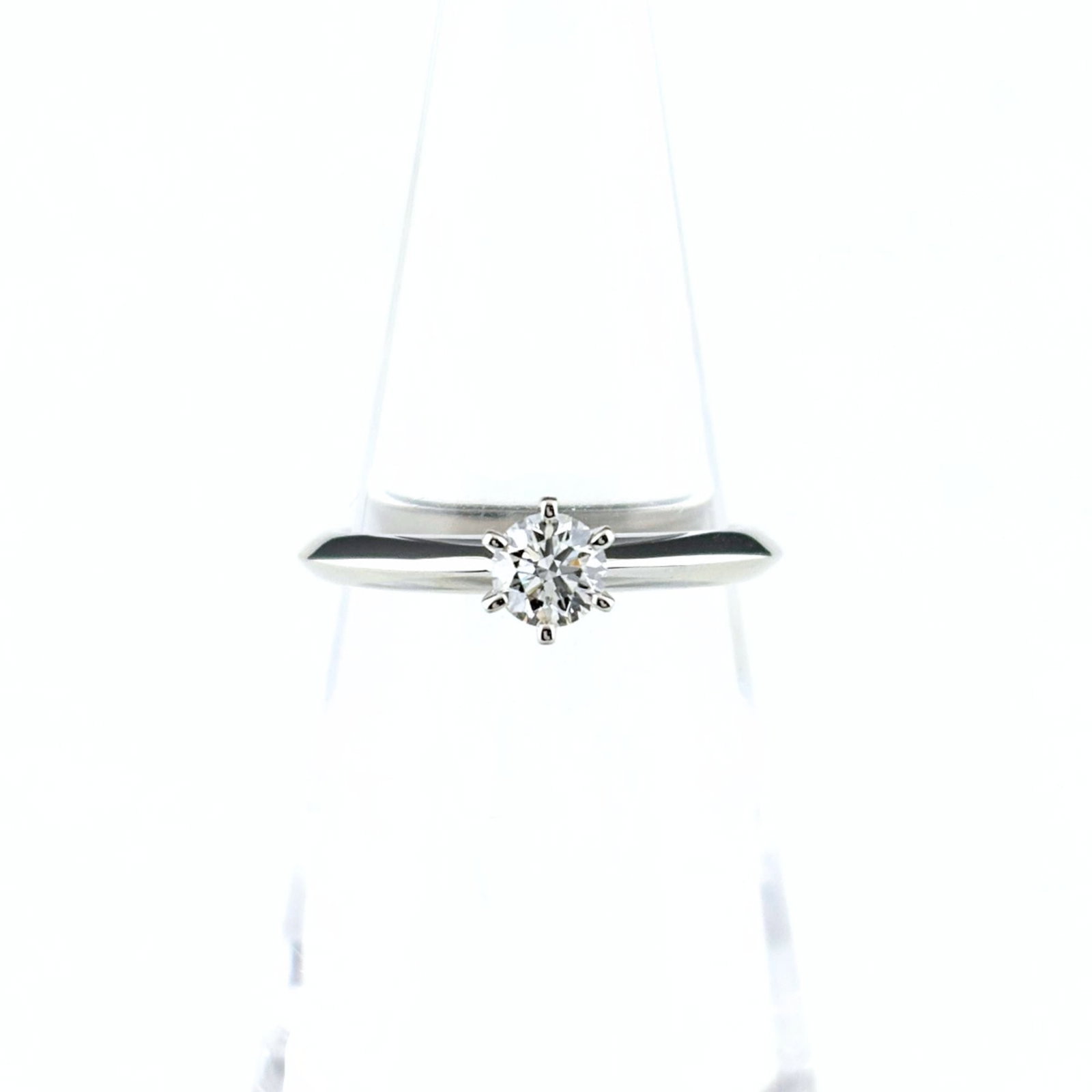 TIFFANY Band Ring Platinum 950: TIFFANY Band Ring Platinum 950 Platinum 950 Tiffany band ring with a diamond stone, this 4.5 US size ring features visible scratches and scuffs from normal wear. The ring is made of high-quality plati