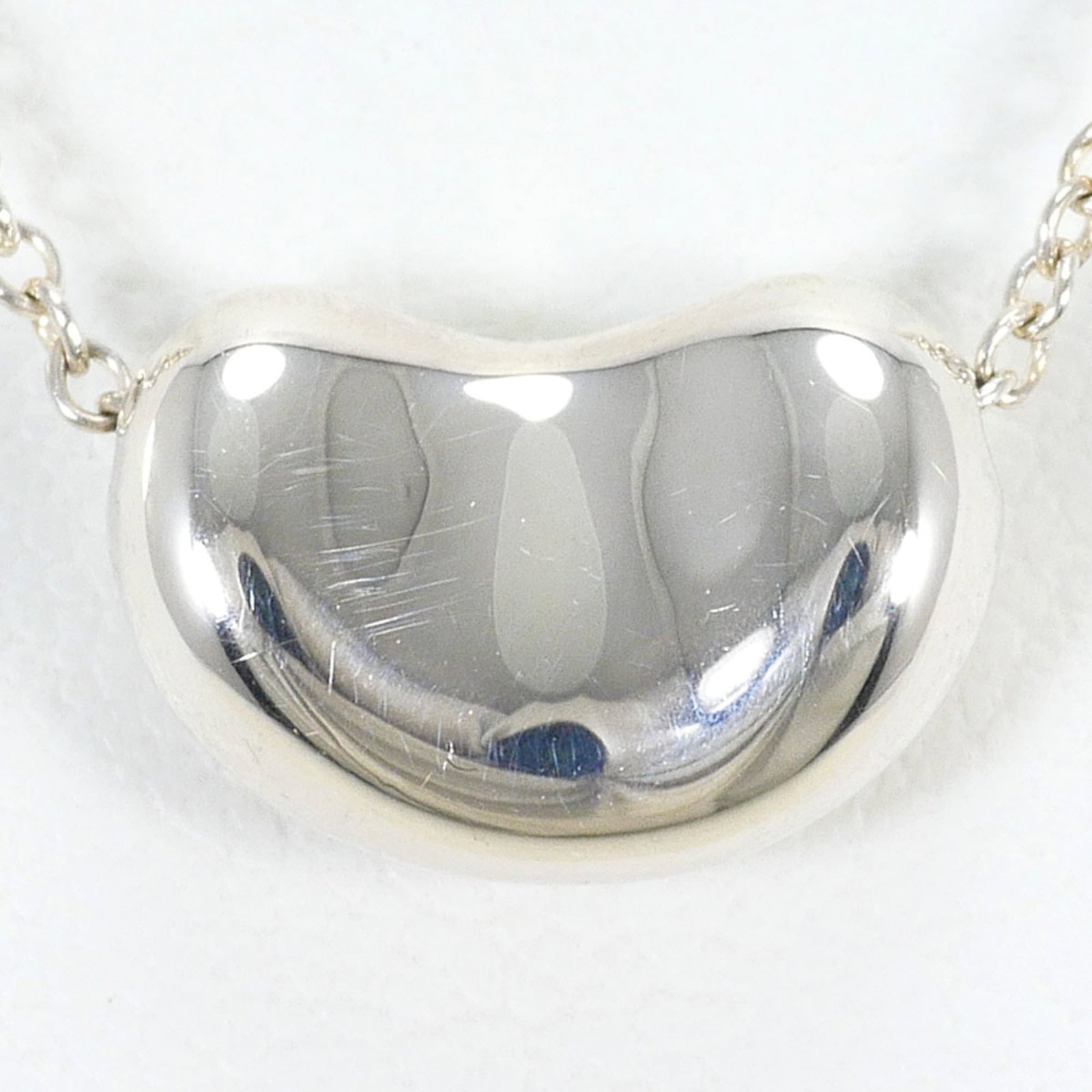 TIFFANY Silver 925: TIFFANY Silver 925 Silver 925 Tiffany Necklace, a stunning piece of jewelry featuring a 8mm x 11mm pendant, is available for purchase. Made from high-quality silver, this necklace boasts a sleek and