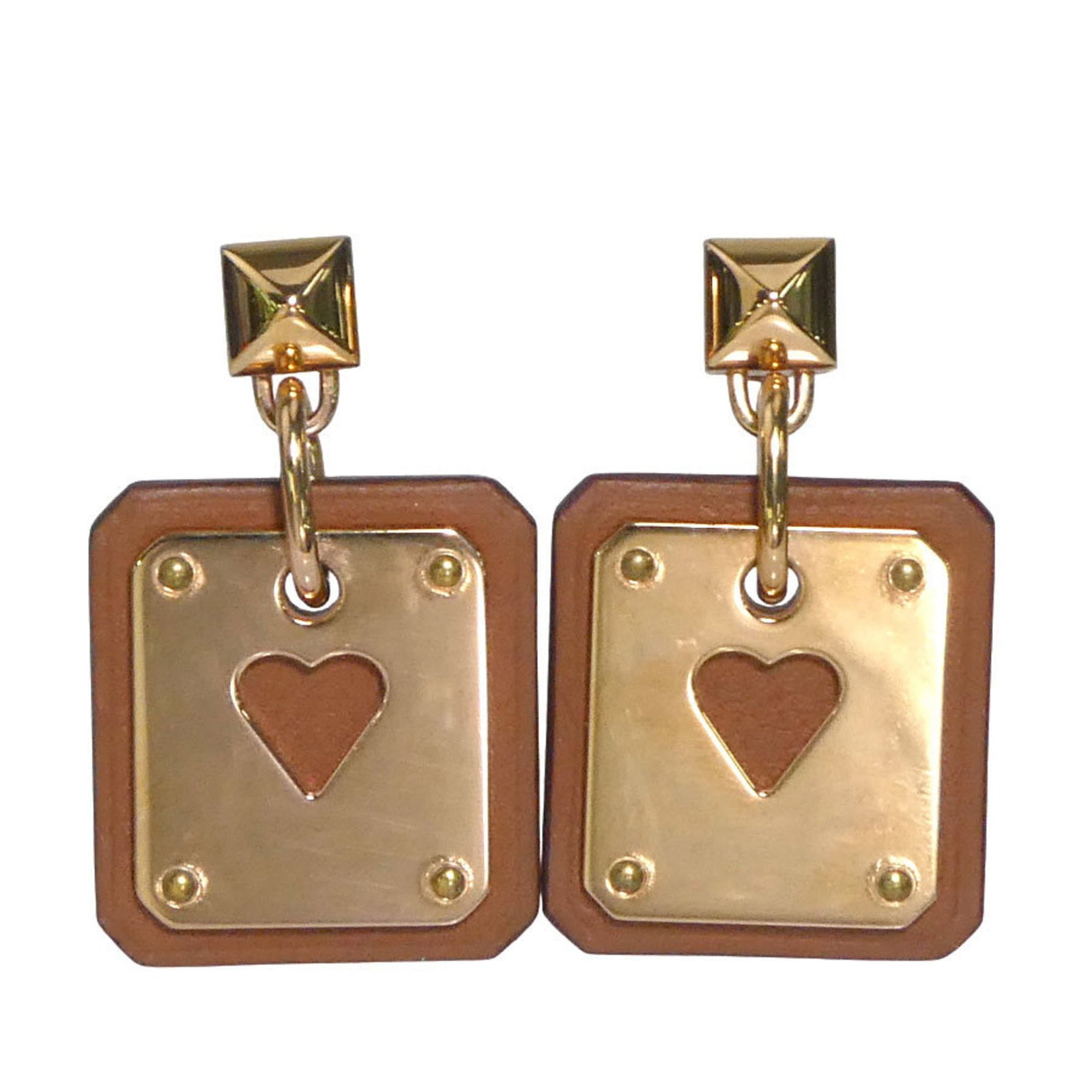 HERMES Stud Earrings Metal Swift Leather: HERMES Stud Earrings Metal Swift Leather Stud earrings from the iconic French fashion house Hermes, featuring metal and swift leather details. The brown and pink gold color adds a touch of elegance to