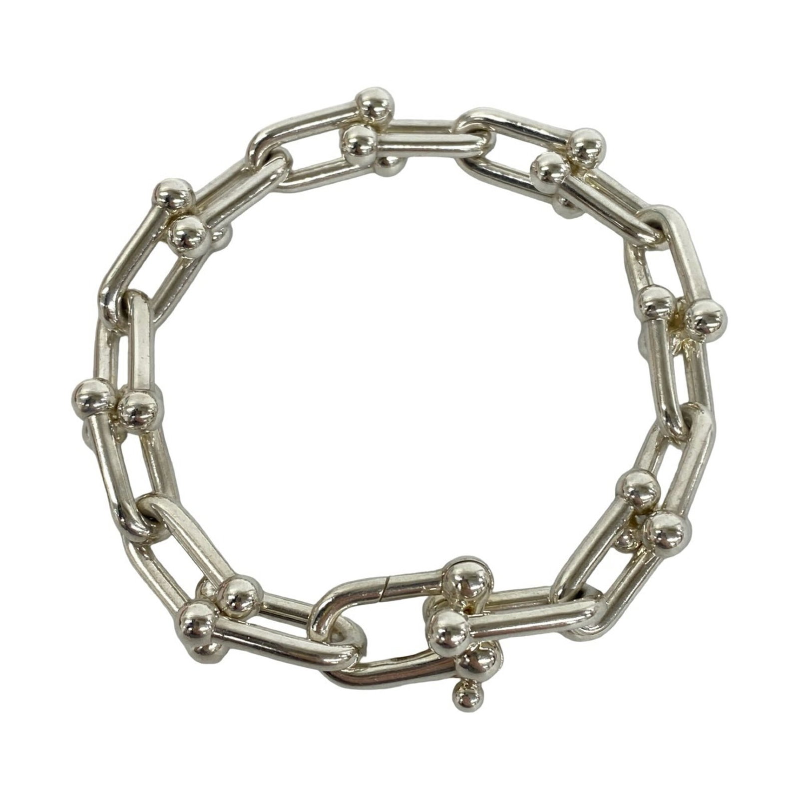 TIFFANY Link Bracelet Silver 925: TIFFANY Link Bracelet Silver 925 Silver 925 Link Bracelet from Tiffany, featuring a classic design with visible wear and scratches. The 19cm length provides a versatile fit, while the silver material 