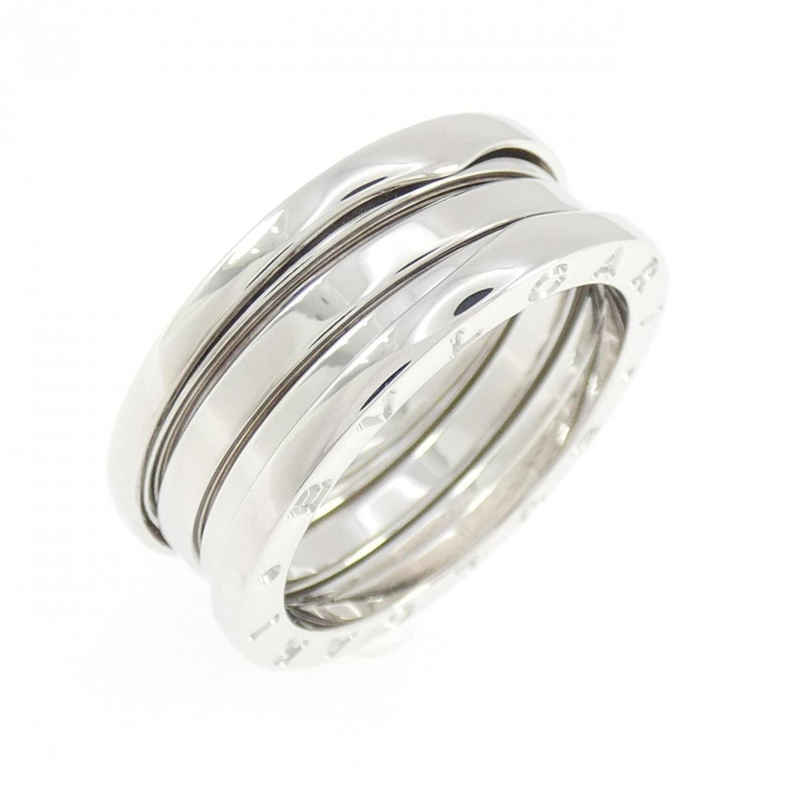 BVLGARI Band Ring White Gold (18K): BVLGARI Band Ring White Gold (18K) BVLGARI Band Ring White Gold (18K) is a stunning women's band ring crafted from 18K white gold. The ring features a classic band design with a subtle sheen, and its