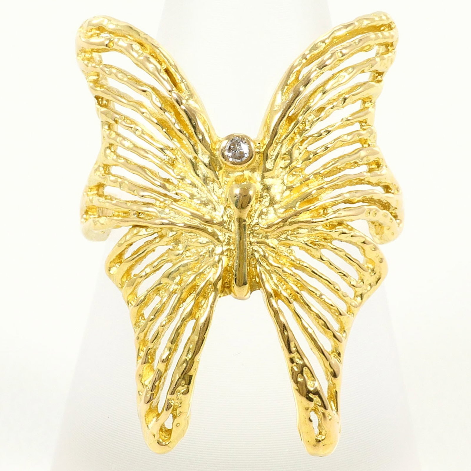 Band Ring Yellow Gold (18K): Band Ring Yellow Gold (18K) Yellow gold band ring with a 0.02ct diamond, crafted from 18K gold and available in a US size 6. This elegant ring boasts a 26mm width and weighs 5.1g, making it a statemen
