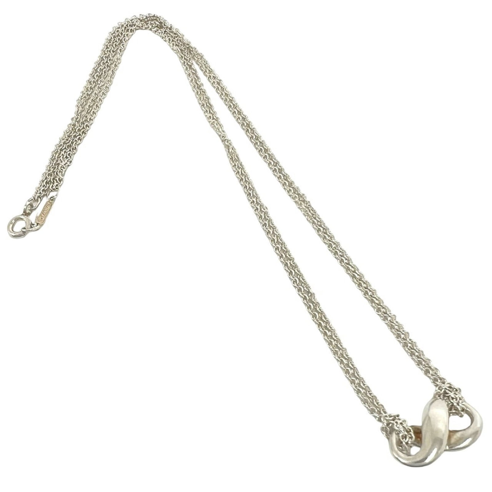 TIFFANY Silver 925: TIFFANY Silver 925 Silver Tiffany Necklace Pendant. This 925 silver necklace features a 9mm x 18mm pendant with a silver 925 finish, measuring 40.5 cm in circumference. The pendant bears a visible