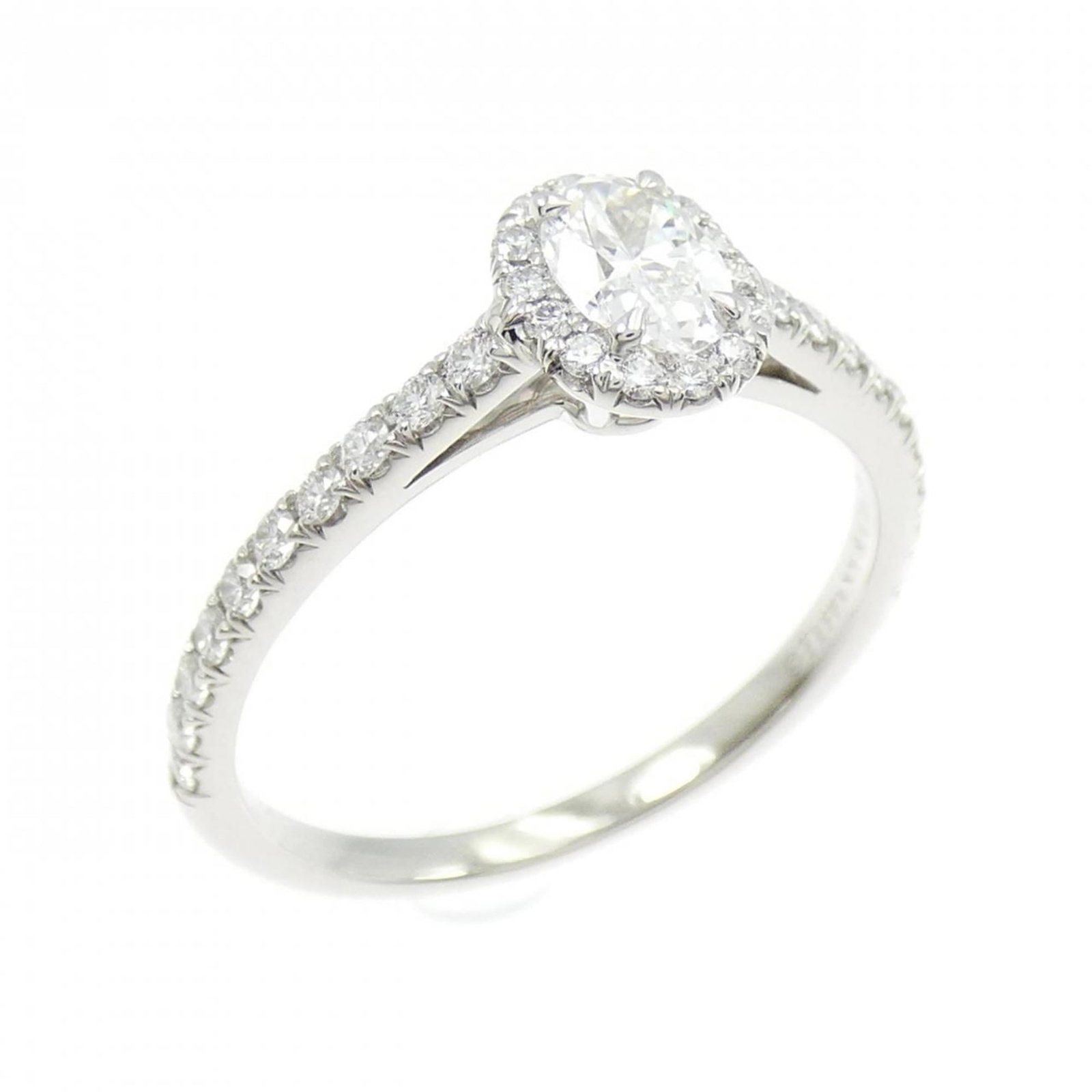 TIFFANY Platinum: TIFFANY Platinum Platinum Tiffany ring with a diamond grading report, bearing a signature. Gently used, this piece shows minor signs of wear, with small scratches or light marks present. Overall, it