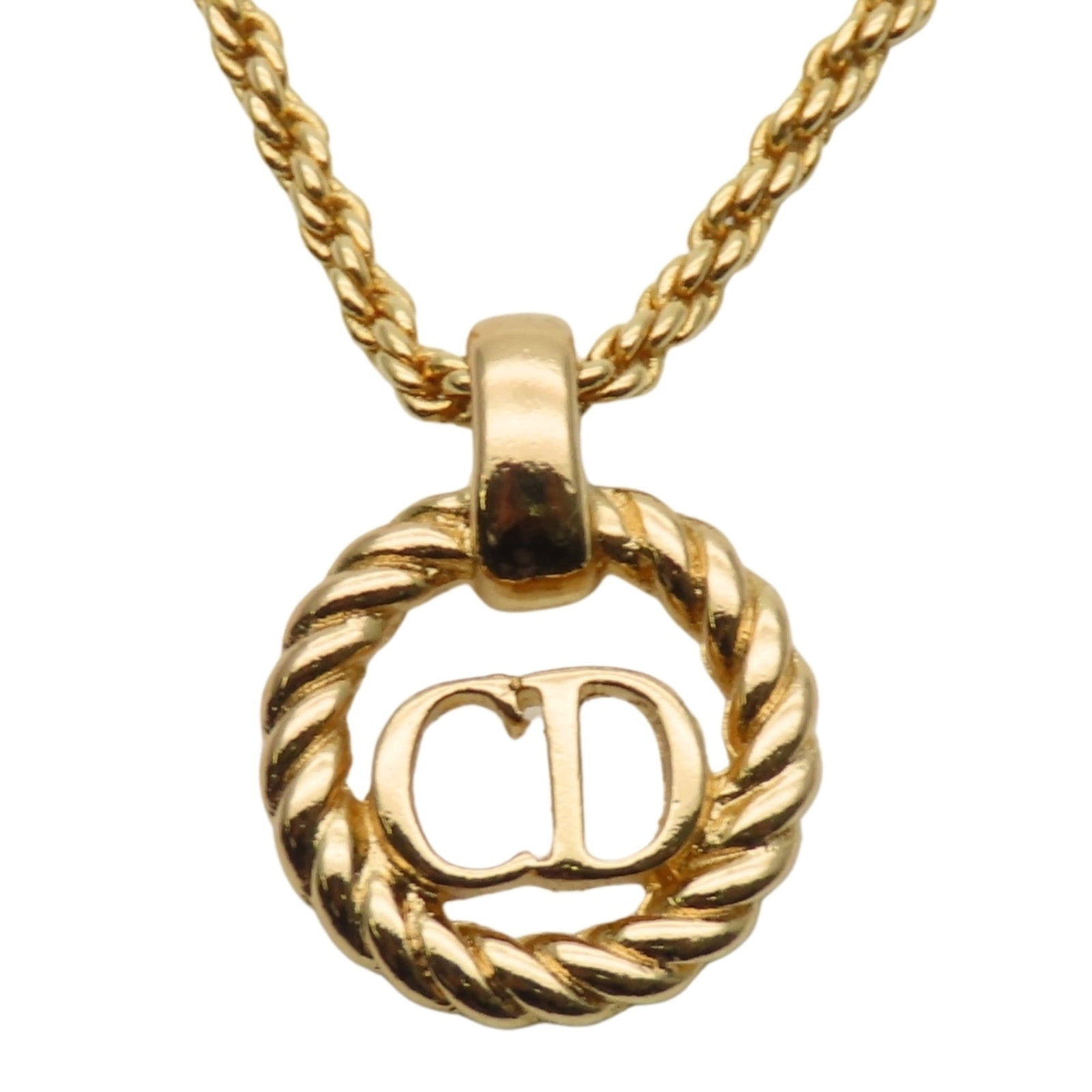 CHRISTIAN DIOR Metal: CHRISTIAN DIOR Metal Gently used gold Christian Dior metal necklace with a 15.8mm x 12.4mm pendant, available in a 43.5 cm / 17.12'' adjustable neck circumference. The necklace bears minor signs of