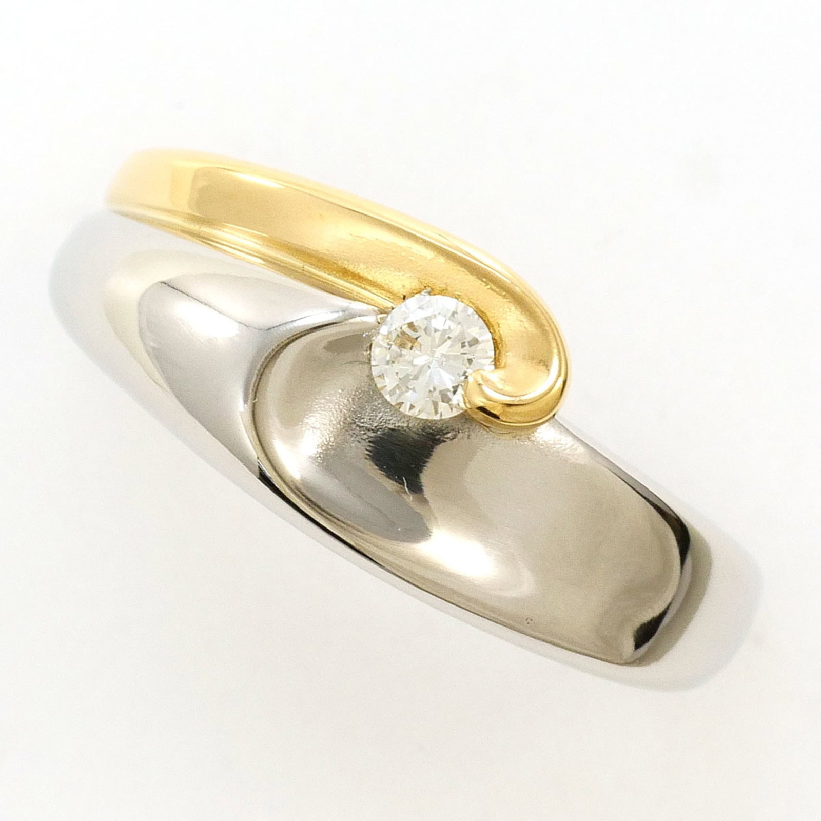 Band Ring Platinum 900 Yellow Gold (18K): Band Ring Platinum 900 Yellow Gold (18K) Platinum 900 Yellow Gold (18K) band ring features a 0.10ct diamond, set in a 7mm wide band with a US size 5 fit. Made from 18K gold and platinum, this ring boa