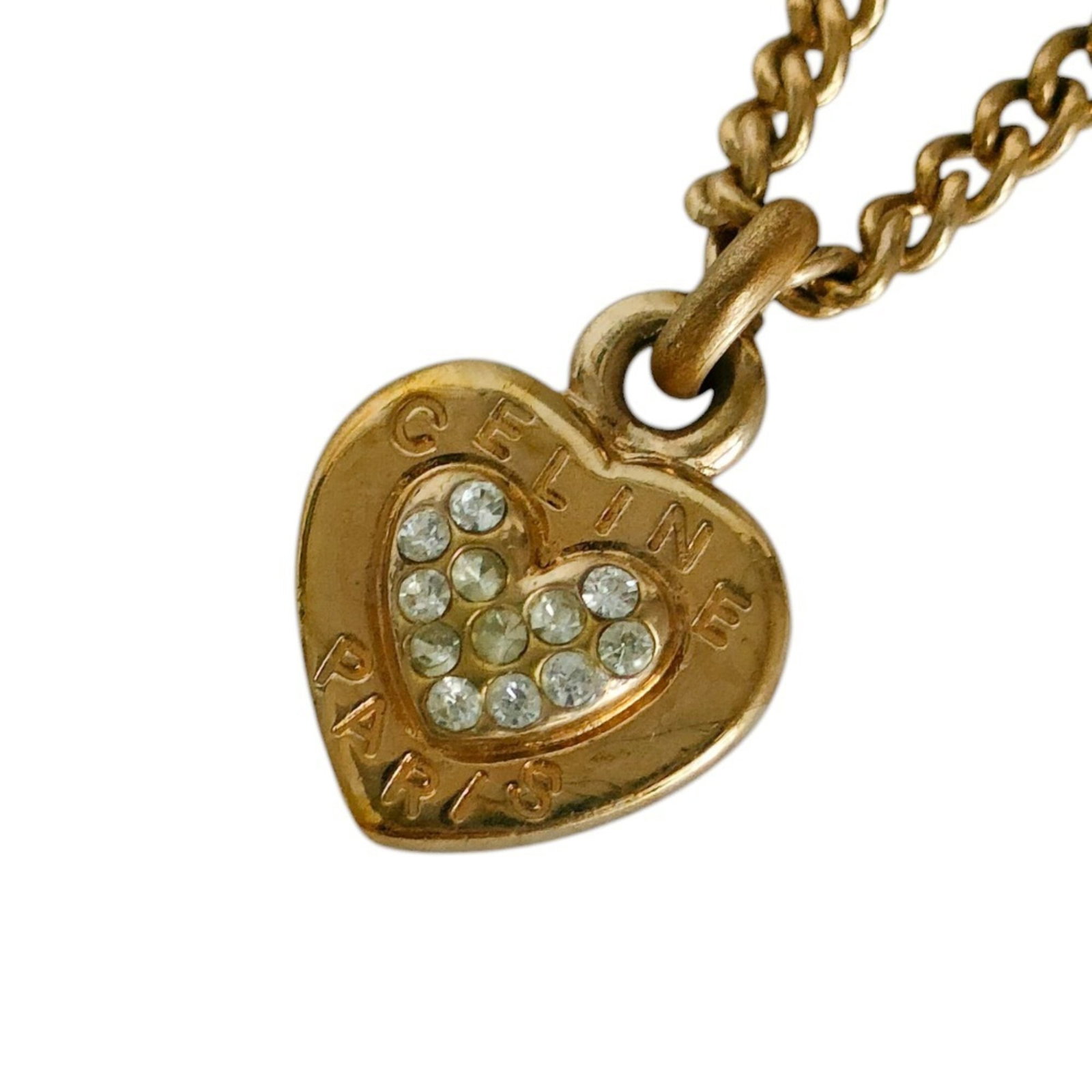CELINE Gold Plating Metal: CELINE Gold Plating Metal Gold plating metal pendant from Celine, featuring a 20mm x 15mm gold pendant with minor signs of wear. The item is in very good condition, gently used with small scratches or