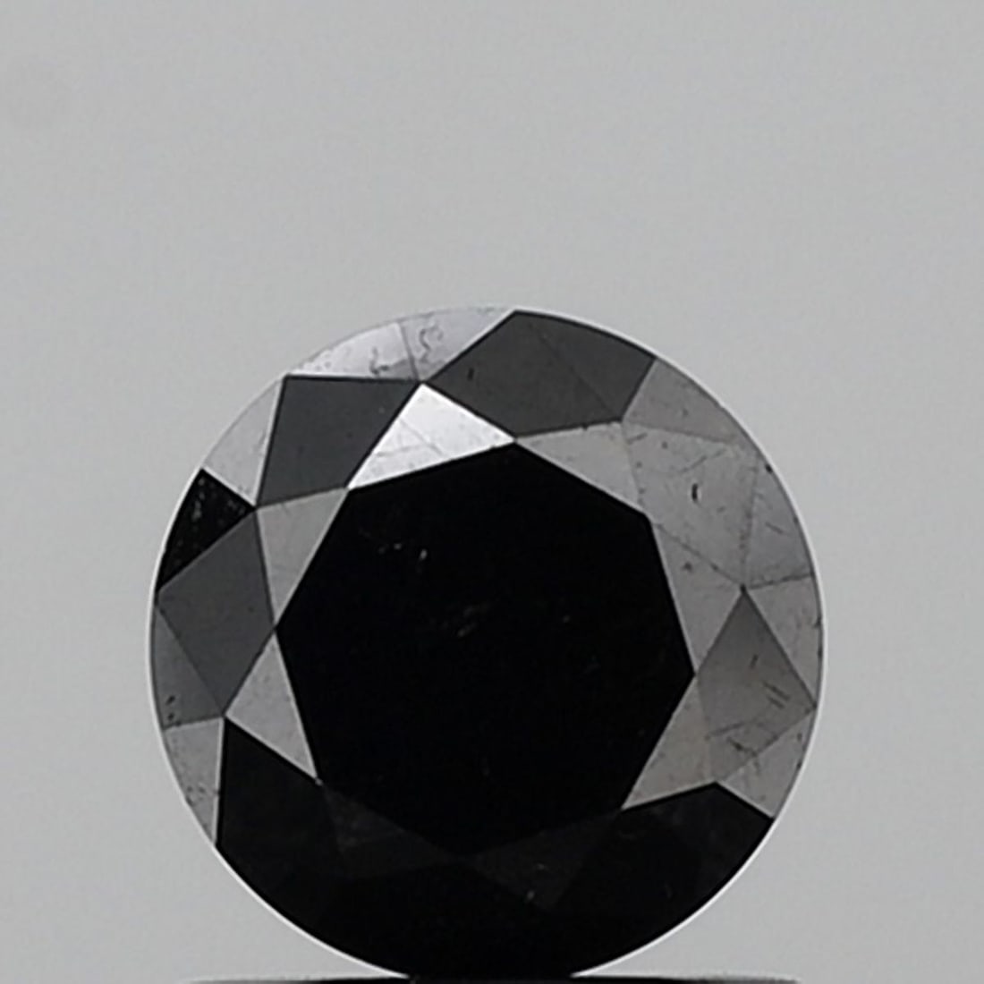 Round 1.06ct Black VVS2 - Loose Natural Diamond: Round 1.06ct Black VVS2 - Loose Natural Diamond Round 1.06ct Black VVS2 - Loose Natural DiamondThis 1.06ct black diamond boasts exceptional clarity, with a VVS2 grade indicating minimal inclusions. It