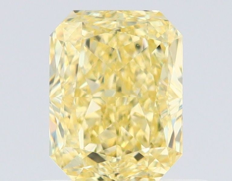 GIA Radiant 0.73ct Fancy Yellow VVS1 - Loose Natural Diamond: GIA Radiant 0.73ct Fancy Yellow VVS1 - Loose Natural Diamond GIA certified, this 0.73ct Fancy Yellow VVS1 diamond boasts exceptional clarity and a vibrant, sunny color. Its EX polish and VG symmetry s