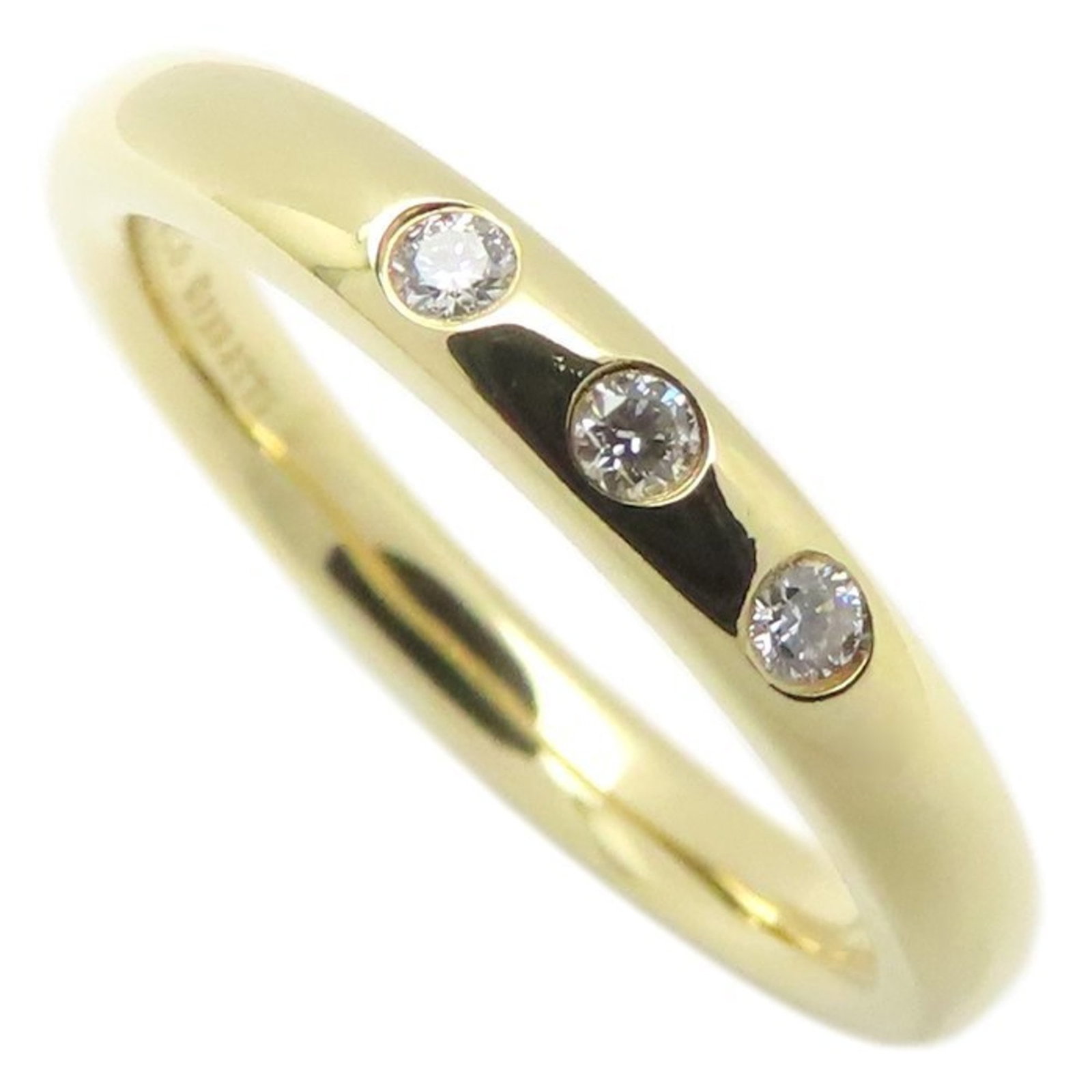 TIFFANY Band Ring Yellow Gold (18K): TIFFANY Band Ring Yellow Gold (18K) Yellow gold band ring from Tiffany, featuring a diamond stone, crafted from 18K gold and available in US size 5.5. This like new used ring boasts excellent conditio