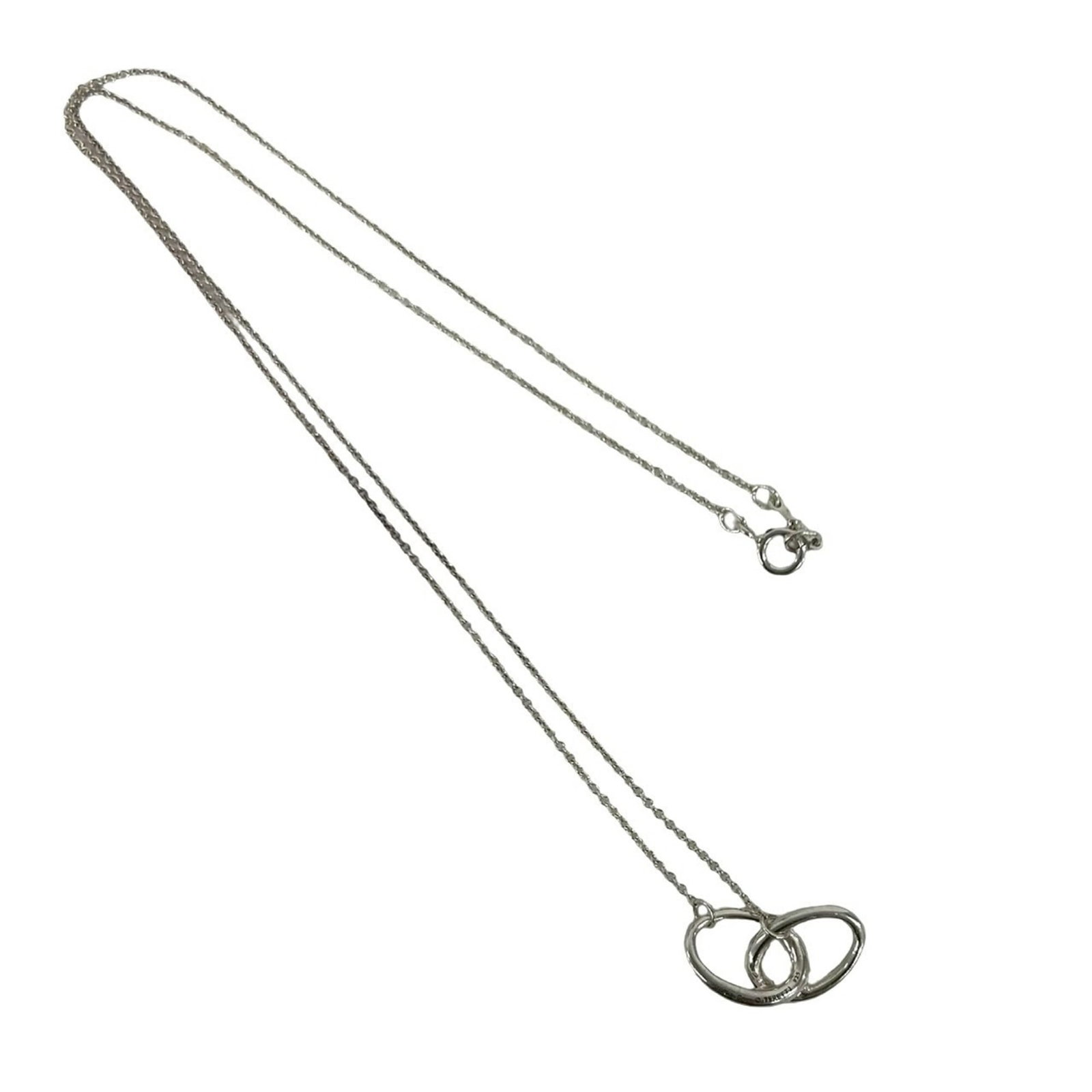 TIFFANY Silver 925: TIFFANY Silver 925 Silver 925 Tiffany Necklace Pendant - A Timeless Silver Pendant with Visible Wear. This 43cm necklace features a 11mm x 13mm silver pendant with scratches and scuffs, showcasing
