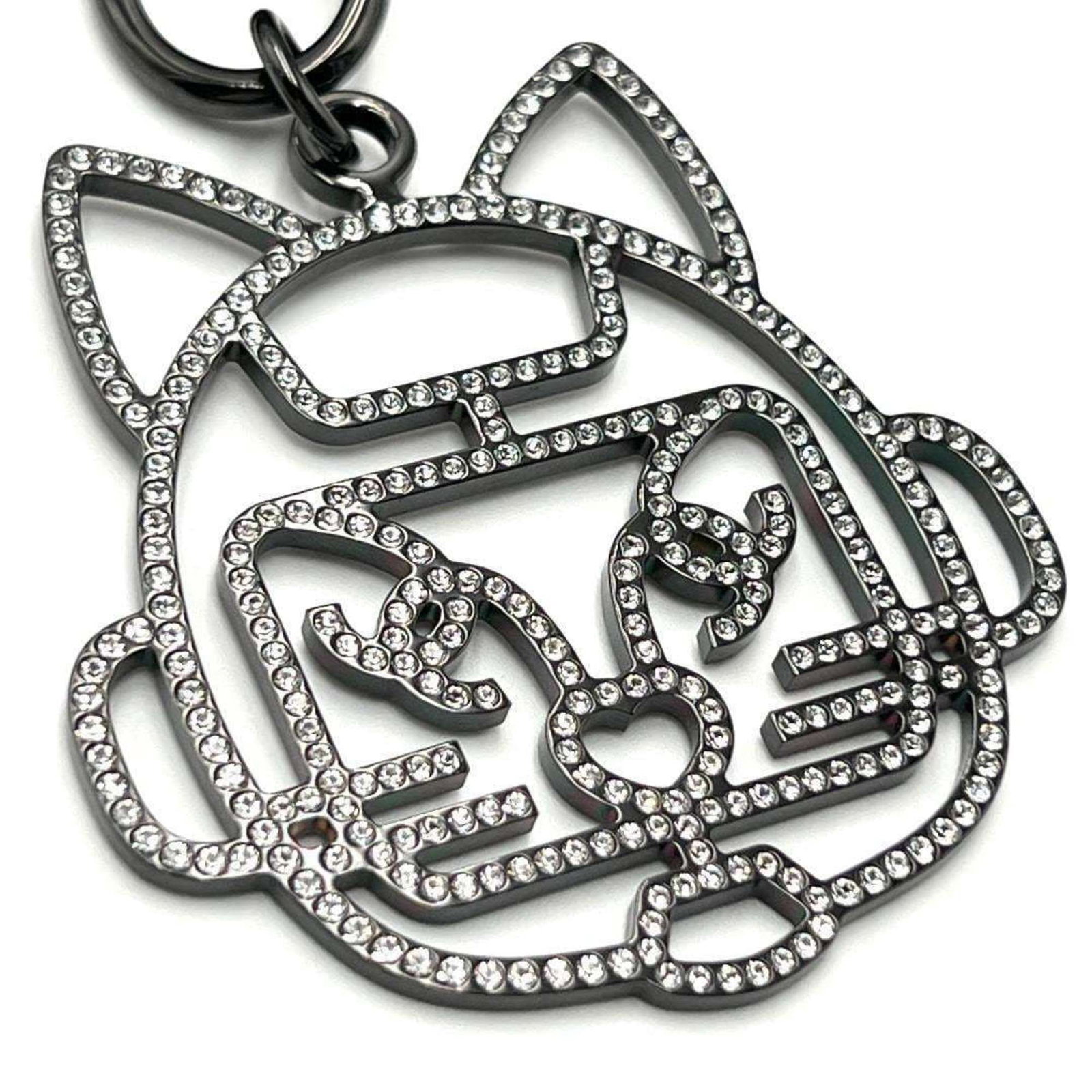 CHANEL Metal Rhinestone: CHANEL Metal Rhinestone Metal Rhinestone Necklace from Chanel, featuring a striking metal and rhinestone design. This necklace boasts a 66 cm circumference, making it a statement piece for any woman. 