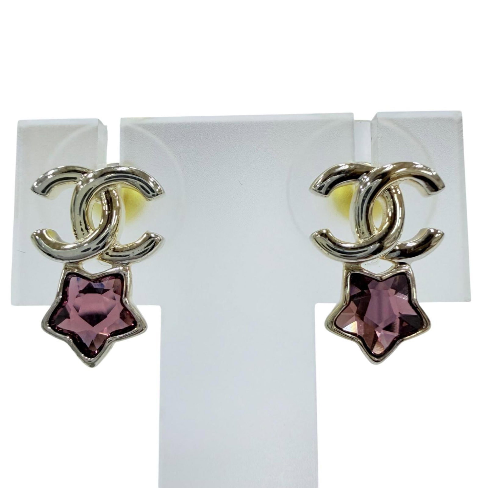 CHANEL Stud Earrings Pink Silver: CHANEL Stud Earrings Pink Silver Pink silver stud earrings from CHANEL, featuring a delicate pink hue and sleek silver finish. Made in Italy, these earrings showcase the brand's signature style with