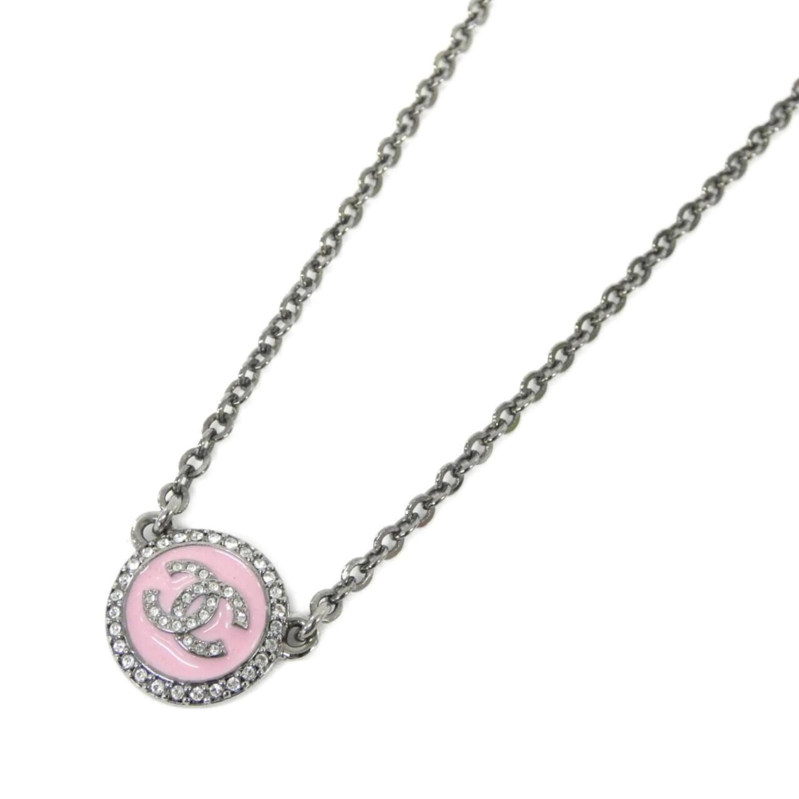 CHANEL Pink Necklace: CHANEL Pink Necklace The CHANEL Pink Necklace is a delicate and elegant piece, featuring a 15mm x 19mm pink pendant that measures 0.59'' x 0.74''. This gently used necklace falls within the 36.5 cm -