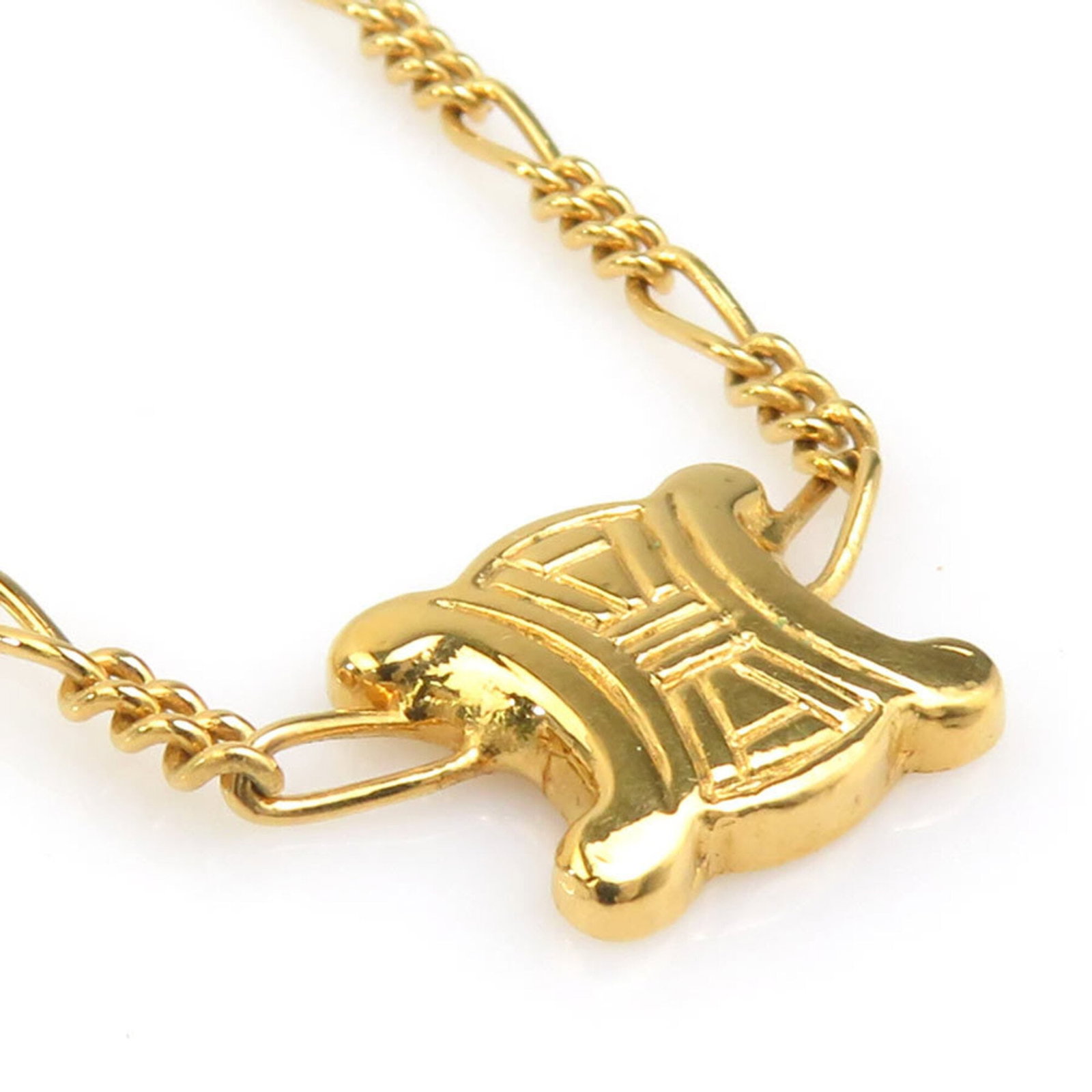 CELINE Metal Gold: CELINE Metal Gold The Celine Metal Gold necklace boasts a sleek, gold metal design with a 10mm x 12mm pendant, perfectly sized for making a statement. Gently used with minor signs of wear, this neckla