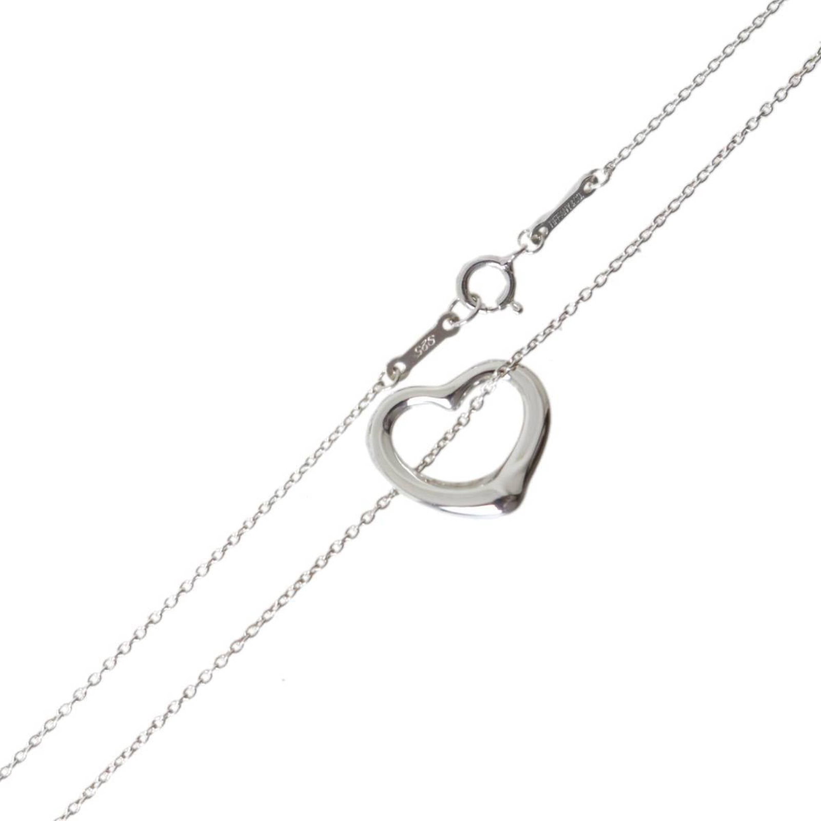 TIFFANY Silver 925: TIFFANY Silver 925 Tiffany Silver 925 Necklace is a beautiful, pre-owned piece featuring a stunning open heart pendant. The necklace boasts a silver 925 material, with a 40.5 cm chain circumference