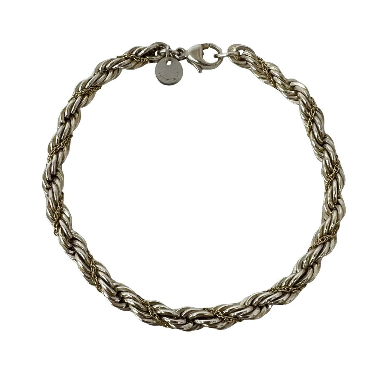 TIFFANY Charm Bracelet Silver 925 Yellow Gold (18K): TIFFANY Charm Bracelet Silver 925 Yellow Gold (18K) Silver 925 and 18K yellow gold combine in this classic Tiffany charm bracelet, offering a timeless and elegant look. With a length of 17.5cm, this