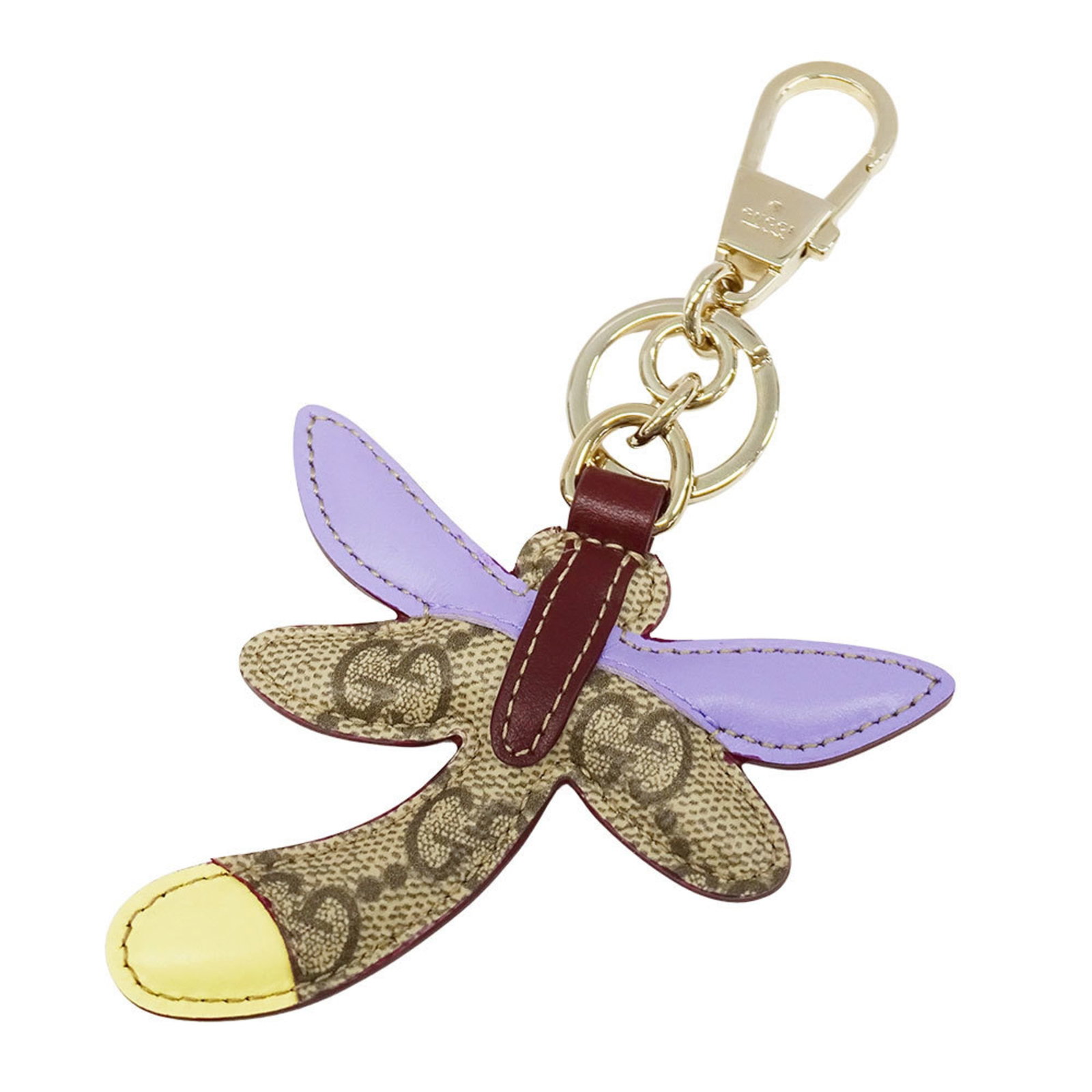 GUCCI Handbag Charm Leather: GUCCI Handbag Charm Leather Beige or multi-color Gucci leather charm, measuring 150.00mm x 90.00mm, is a Good Used handbag accessory. The charm bears visible scratches, scuffs, and dirt, but remains