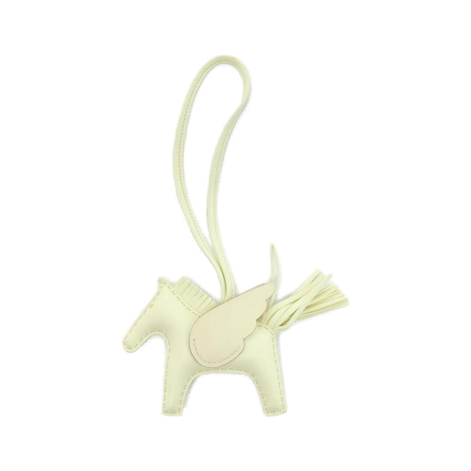 HERMES Handbag Charm Agneau Milo: HERMES Handbag Charm Agneau Milo Agneau Milo charm from Hermes, a unique and elegant handbag accessory featuring a natural stone. The charm measures 75.00mm x 85.00mm and bears a signature. In very
