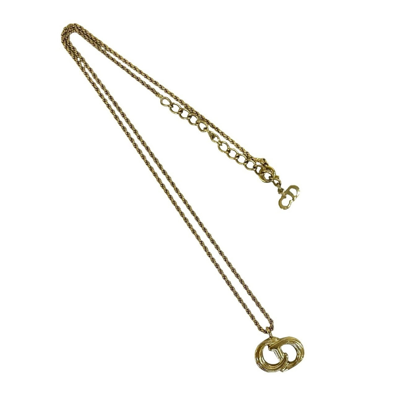 CHRISTIAN DIOR Gold Plating: CHRISTIAN DIOR Gold Plating Gold Plating from Christian Dior, a delicate 15mm x 16mm pendant suspended from a 43.5 cm chain, adds a touch of luxury to any outfit. The item features visible wear,