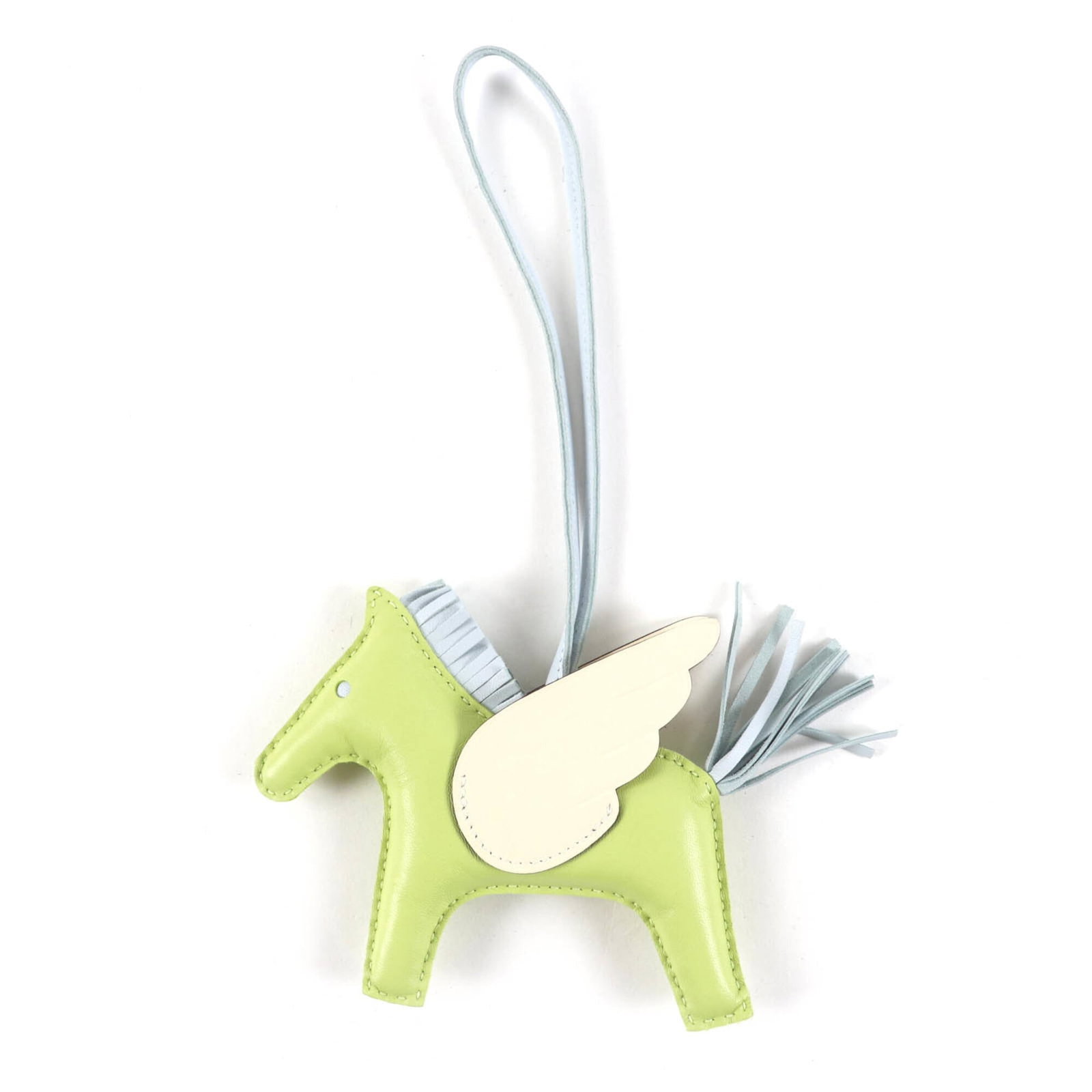 HERMES Handbag Charm Agneau Milo: HERMES Handbag Charm Agneau Milo Agneau Milo, a signature Hermes handbag charm, boasts a unique ivory, light blue, and yellow color combination. Made from high-quality Agneau Milo material, this