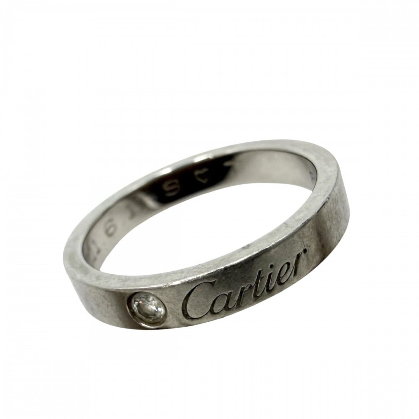 CARTIER Band Ring: CARTIER Band Ring The Cartier Band Ring features a sleek, sophisticated design with a 49 US size band that fits comfortably. This pre-owned ring shows signs of wear, including scratches and scuffs, bu