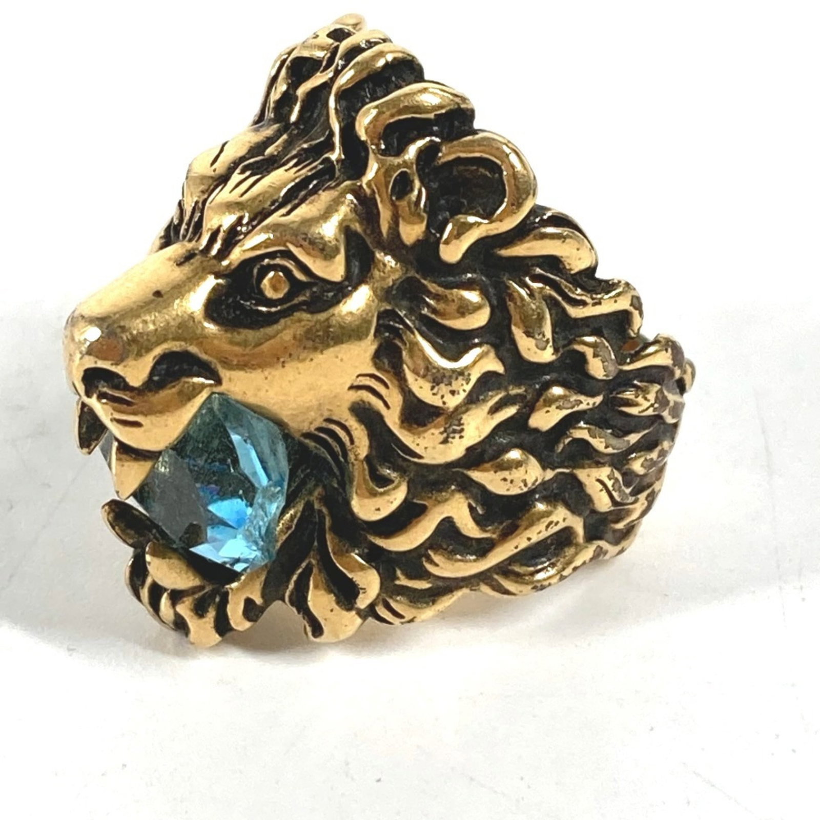 GUCCI Band Ring Metal: GUCCI Band Ring Metal Gold and light blue metal band ring from Gucci, featuring a stylish design with visible scratches and scuffs from previous wear. The item is in good condition, with metal
