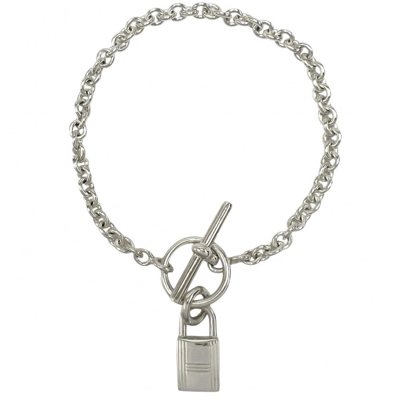 HERMES Charm Bracelet Silver 925: HERMES Charm Bracelet Silver 925 Silver 925 Charm Bracelet from Hermes features a classic design with visible wear, scratches, and scuffs, adding to its unique character. The 16cm length provides a
