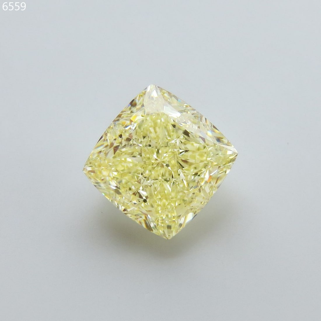GIA Cushion Modified 5.56ct Fancy Light Yellow VVS2 - Loose Natural Diamond: GIA Cushion Modified 5.56ct Fancy Light Yellow VVS2 - Loose Natural Diamond 5.56ct Fancy Light Yellow VVS2 Diamond - A Natural BeautyThe GIA-certified diamond boasts an impressive 5.56ct of Fancy