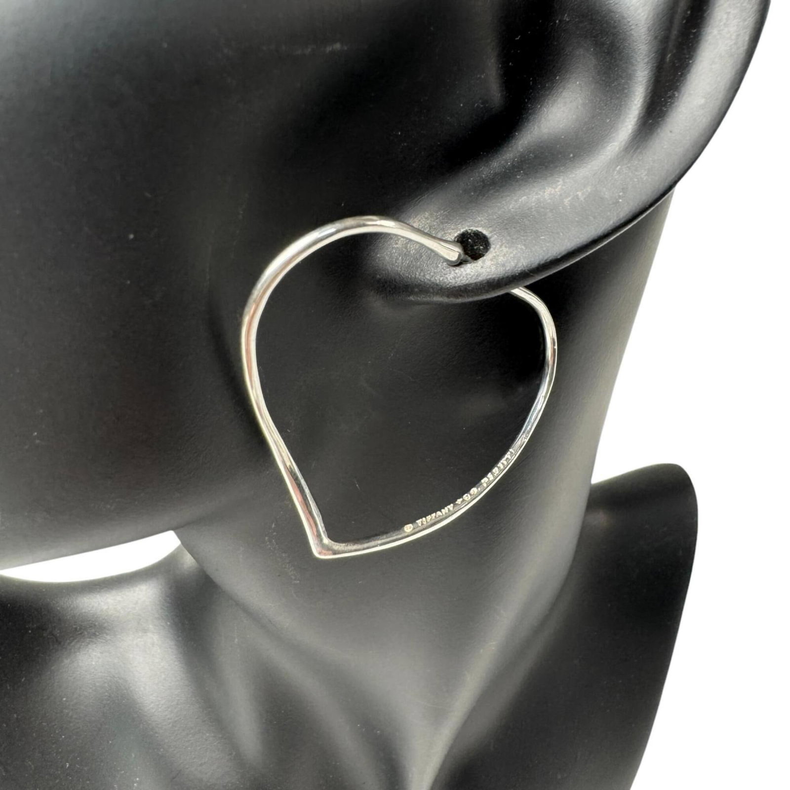 TIFFANY Hoop Earrings Sterling Silver: TIFFANY Hoop Earrings Sterling Silver Sterling silver hoop earrings from Tiffany, featuring a classic design with a subtle sheen. The earrings are made from high-quality silver and have a size of