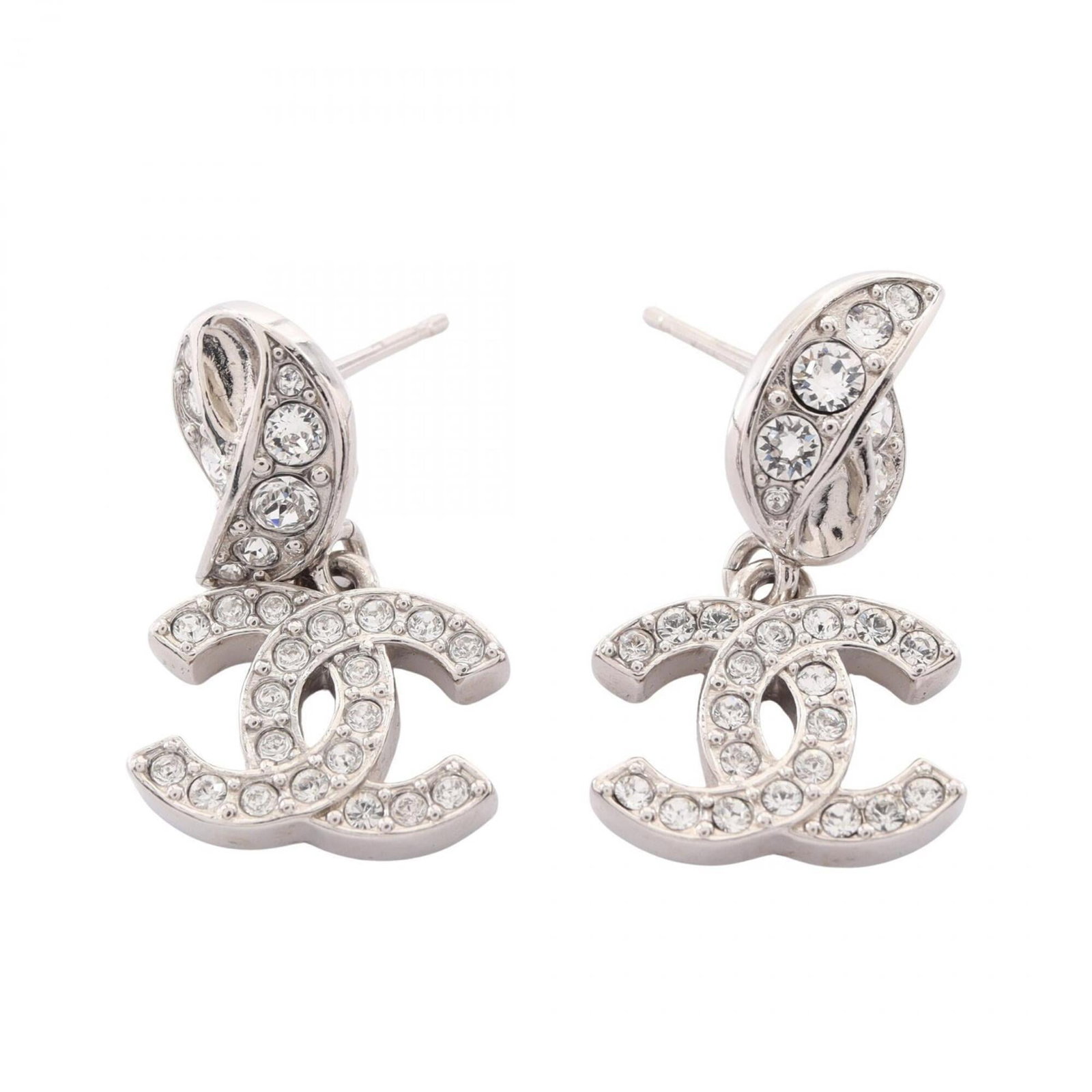 CHANEL Stud Earrings Metal Rhinestone: CHANEL Stud Earrings Metal Rhinestone Stud earrings from the iconic CHANEL brand feature clear rhinestones set in silver metal, adding a touch of luxury to any outfit. Gently used with minor signs of 