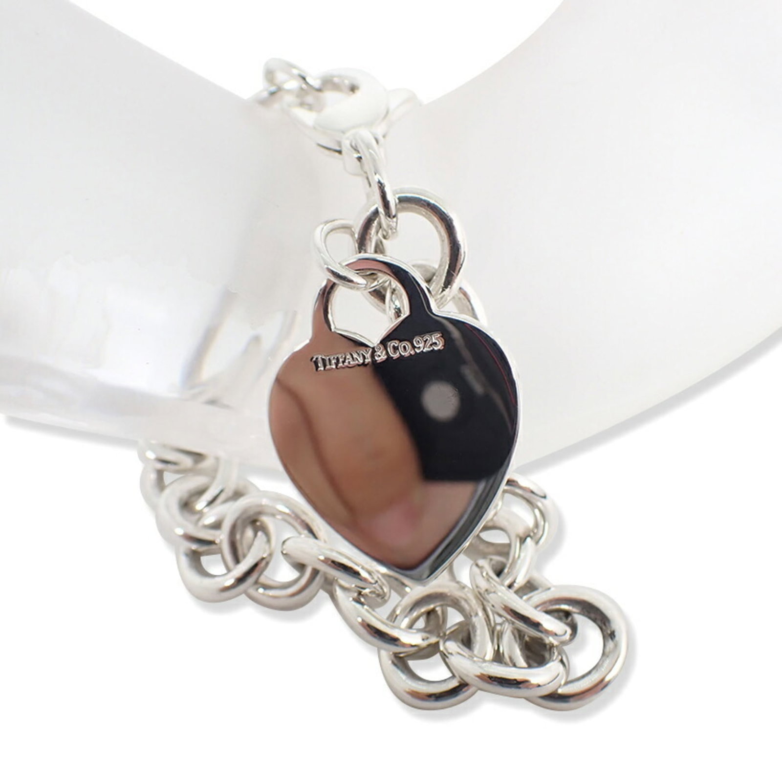 TIFFANY Charm Bracelet Sterling Silver 925: TIFFANY Charm Bracelet Sterling Silver 925 Sterling silver 925 Tiffany charm bracelet in excellent condition, measuring 19cm in length. This like new used bracelet boasts a delicate charm design, show