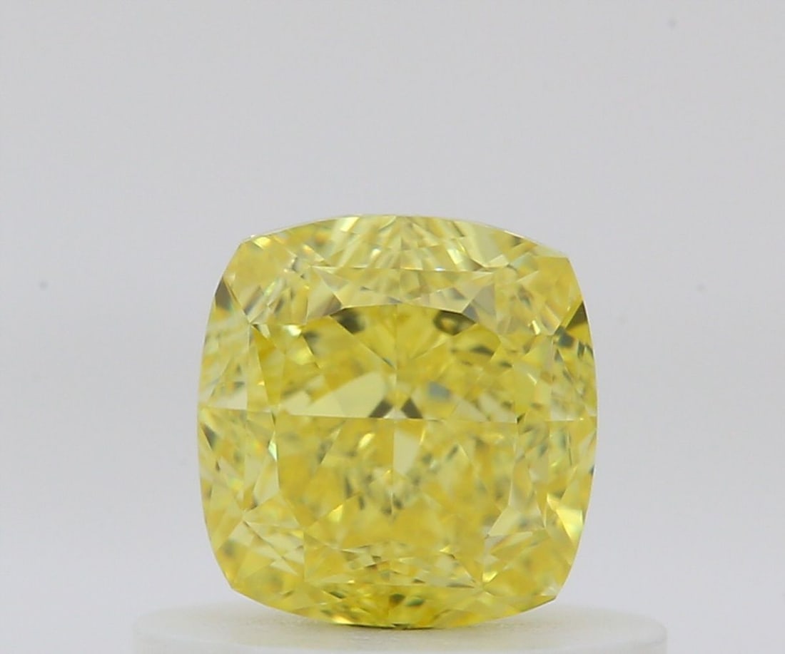 GIA Cushion Brilliant 0.63ct Fancy Vivid Yellow VVS1 - Loose Natural Diamond: GIA Cushion Brilliant 0.63ct Fancy Vivid Yellow VVS1 - Loose Natural Diamond GIA certified, this 0.63ct Fancy Vivid Yellow VVS1 diamond boasts exceptional color and clarity. Its EX polish and VG