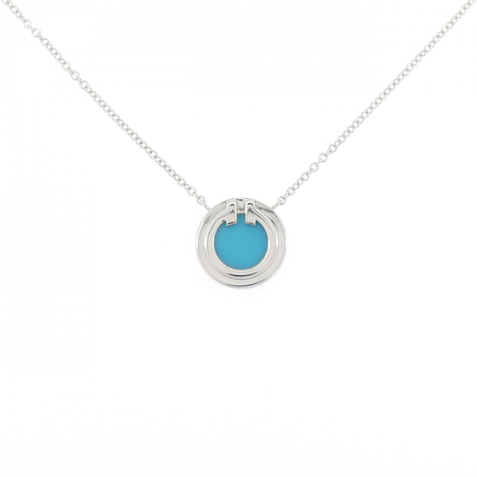 TIFFANY White Gold (18K): TIFFANY White Gold (18K) White gold (18K) Tiffany necklace with a 10.8mm pendant, designed to complement a 40-45 cm neck circumference, features a sleek and sophisticated design. Made from