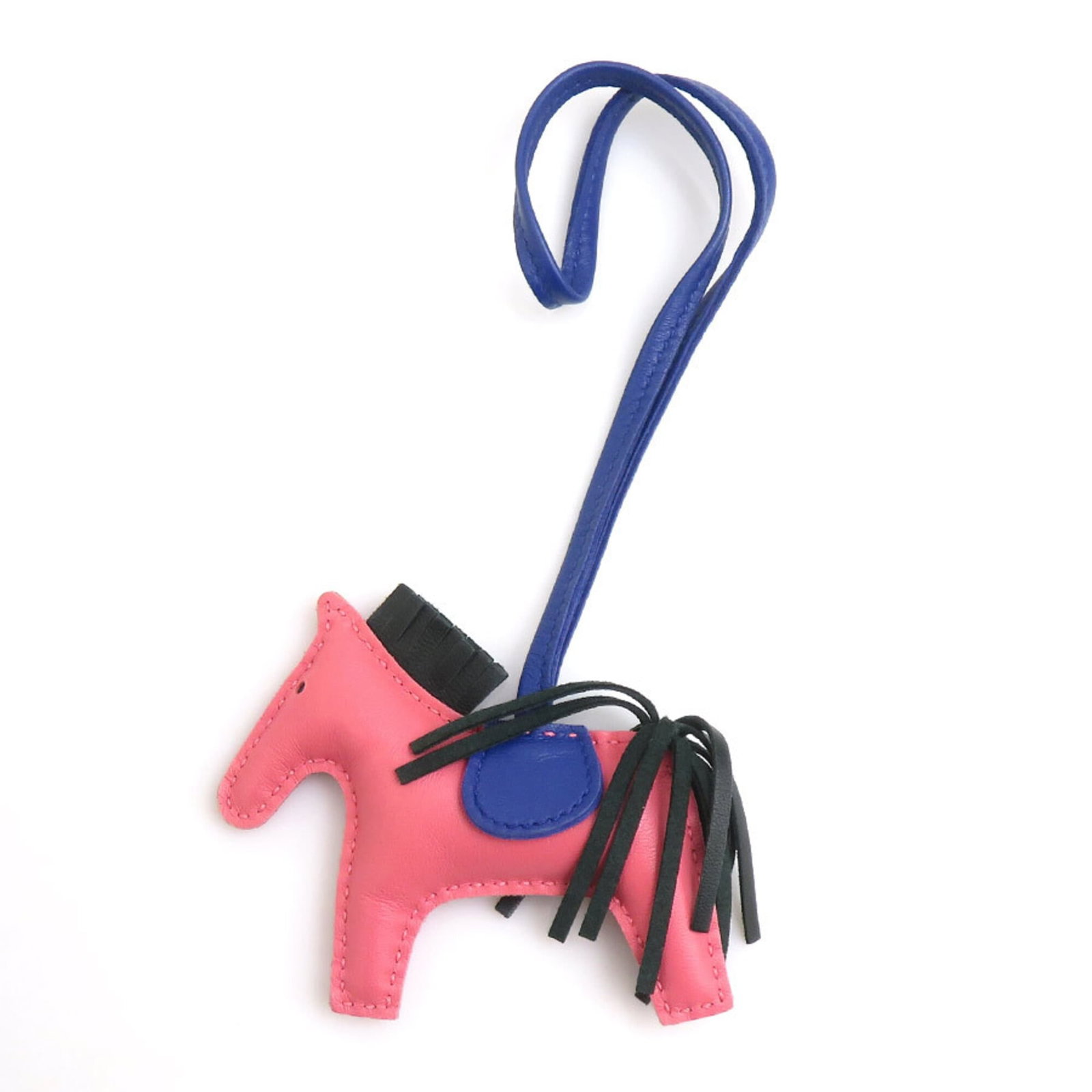 HERMES Handbag Charm Agneau Milo: HERMES Handbag Charm Agneau Milo Agneau Milo is a signature material from Hermes, known for its unique blend of natural ingredients. This handbag charm showcases the distinctive blue electric and pink