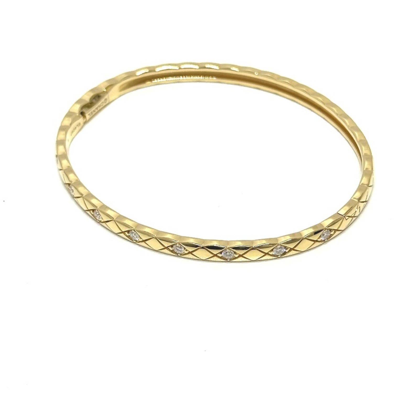 CHANEL Charm Bracelet Yellow Gold (18K): CHANEL Charm Bracelet Yellow Gold (18K) Yellow gold (18K) charm bracelet from the iconic Chanel Line, featuring a diamond stone and a sleek design. This 15cm long, 3mm wide charm bracelet is a